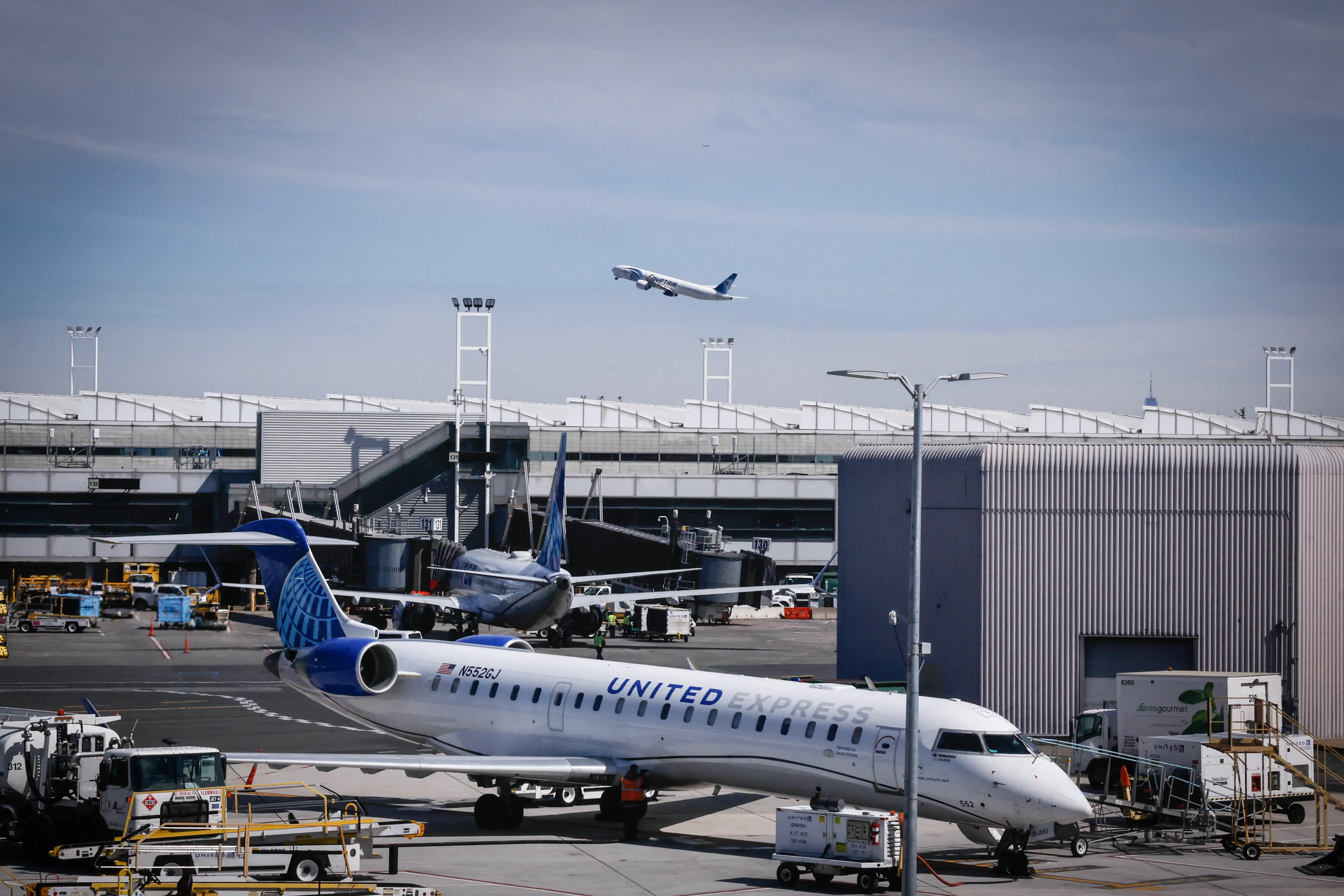 A United Express Mitsubishi CRJ-550 sits on the tarmac at Newark Liberty International Airport in Newark, New Jersey, on March 18, 2026