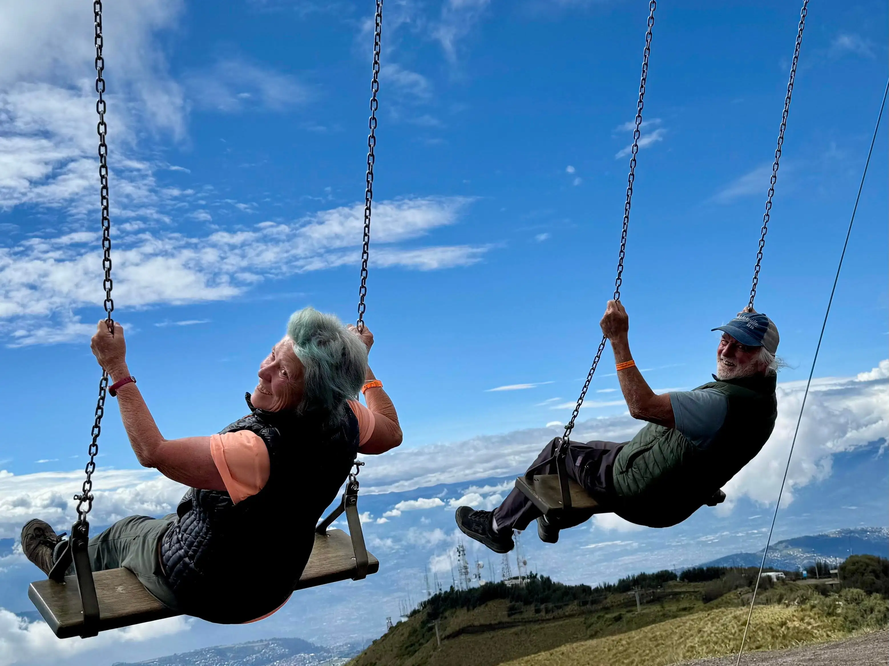 The author and her husband enjoy a pair of swings in Quito, Ecuador.