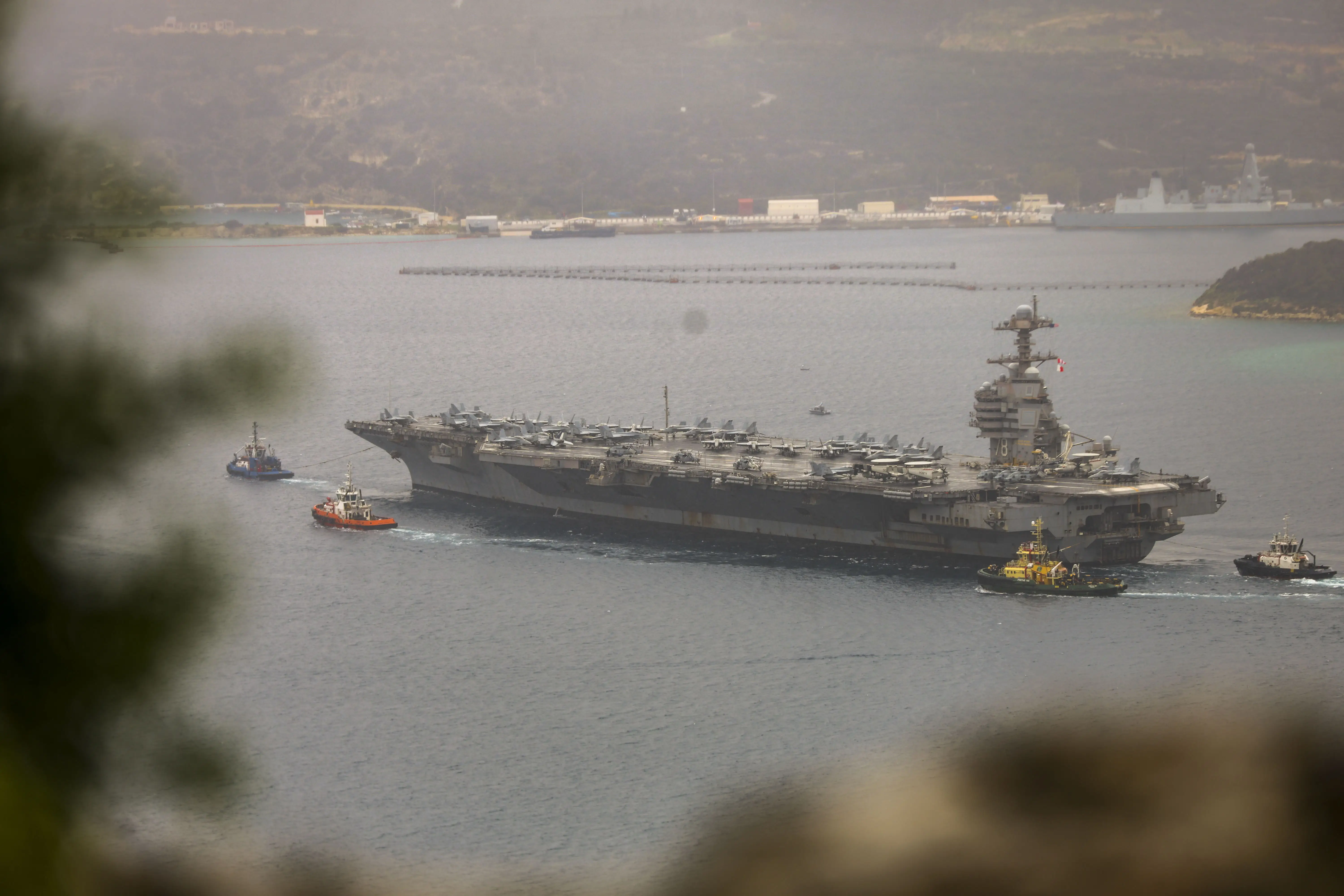 A view of the US aircraft carrier USS Gerald R. Ford at a US Navy base in Souda Bay, Crete, where it is set to undergo repairs on March 23, 2026.