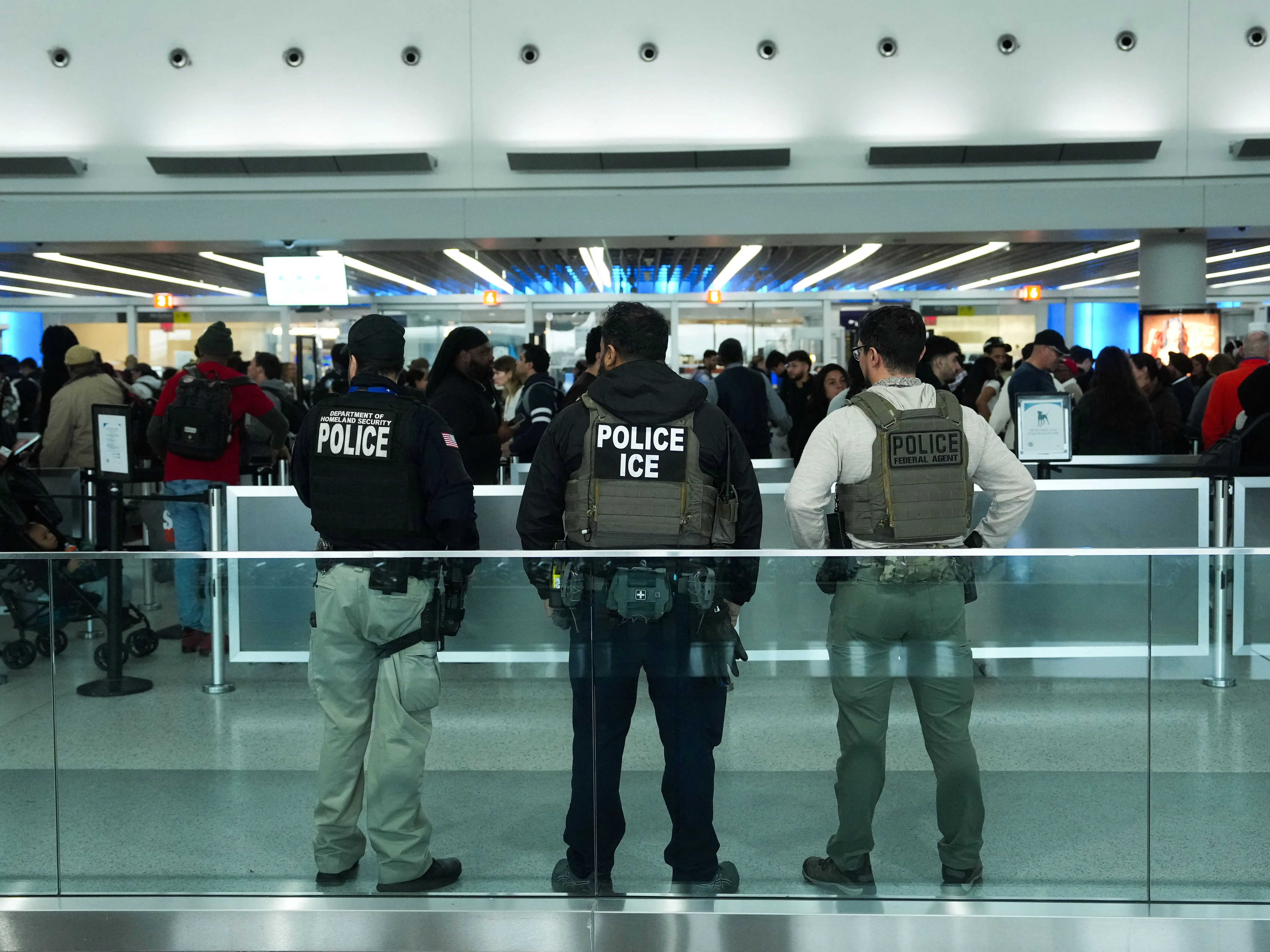 Immigration and Customs Enforcement (ICE) agents patrol at John F. Kennedy International Airport, New York City, U.S. March 23, 2026.