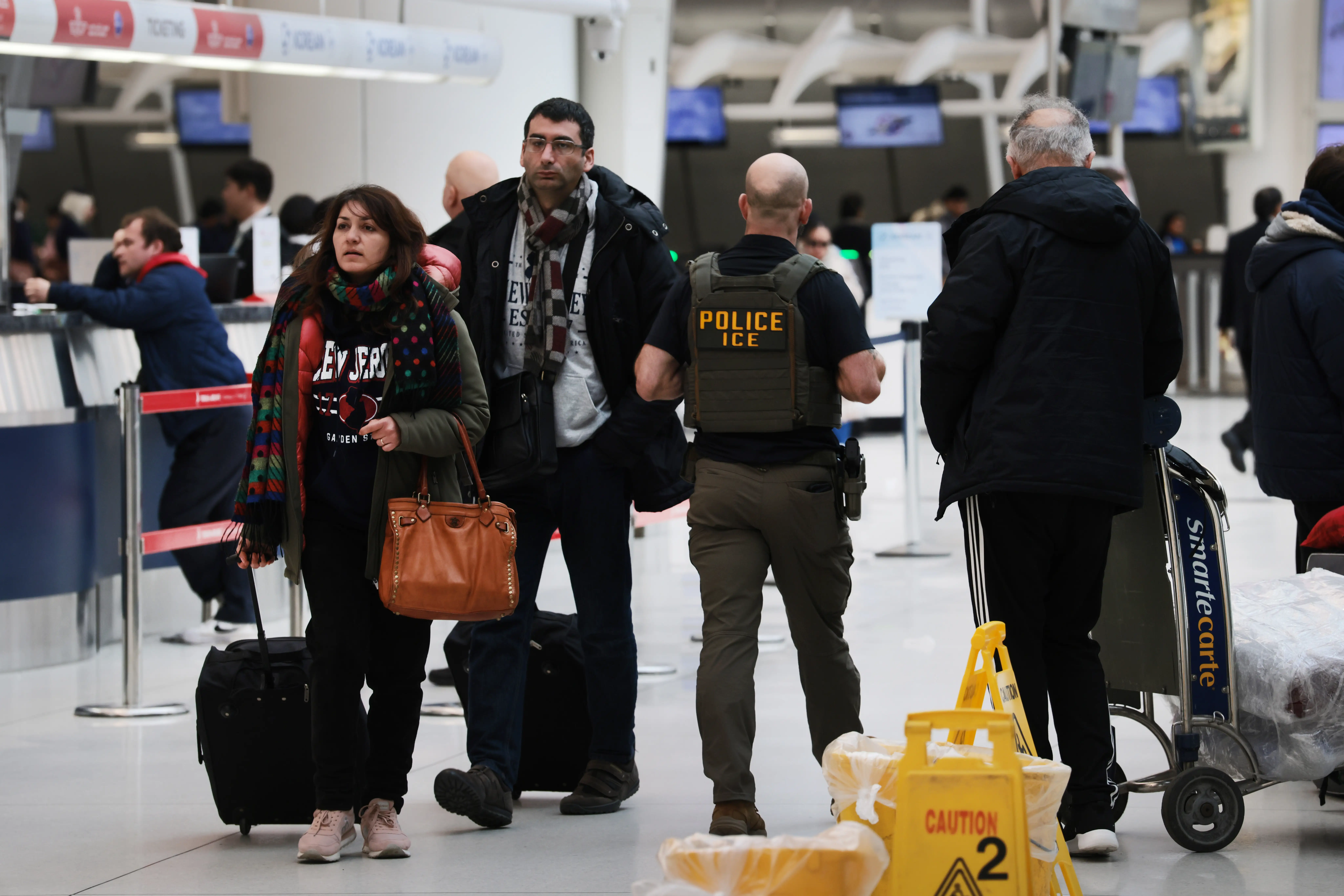 ICE agents at JFK.