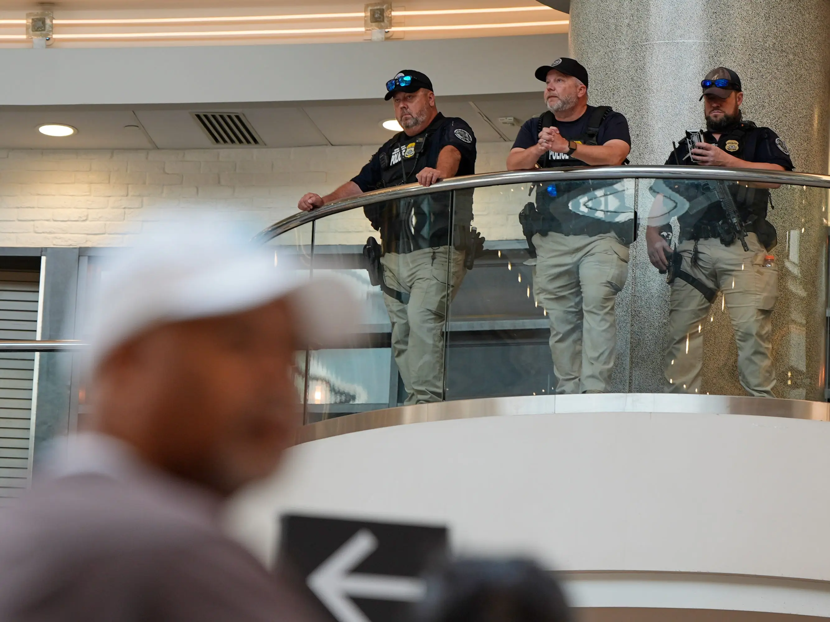 Federal immigration agents are seen at the Hartsfield-Jackson Atlanta International Airport, Monday, March 23, 2026, in Atlanta.