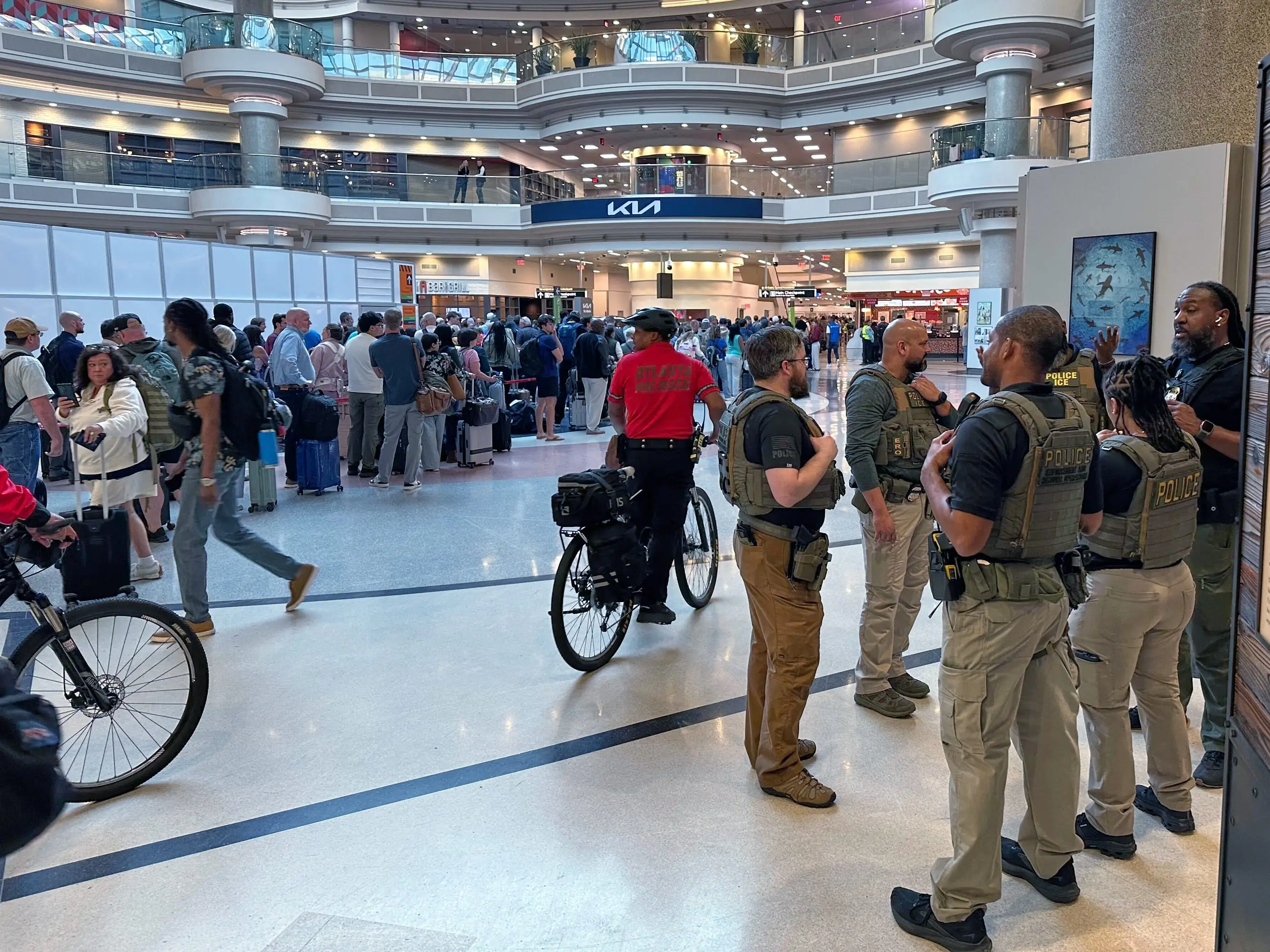 Federal immigration agents are seen at the Hartsfield-Jackson Atlanta International Airport, Monday, March 23, 2026, in Atlanta.