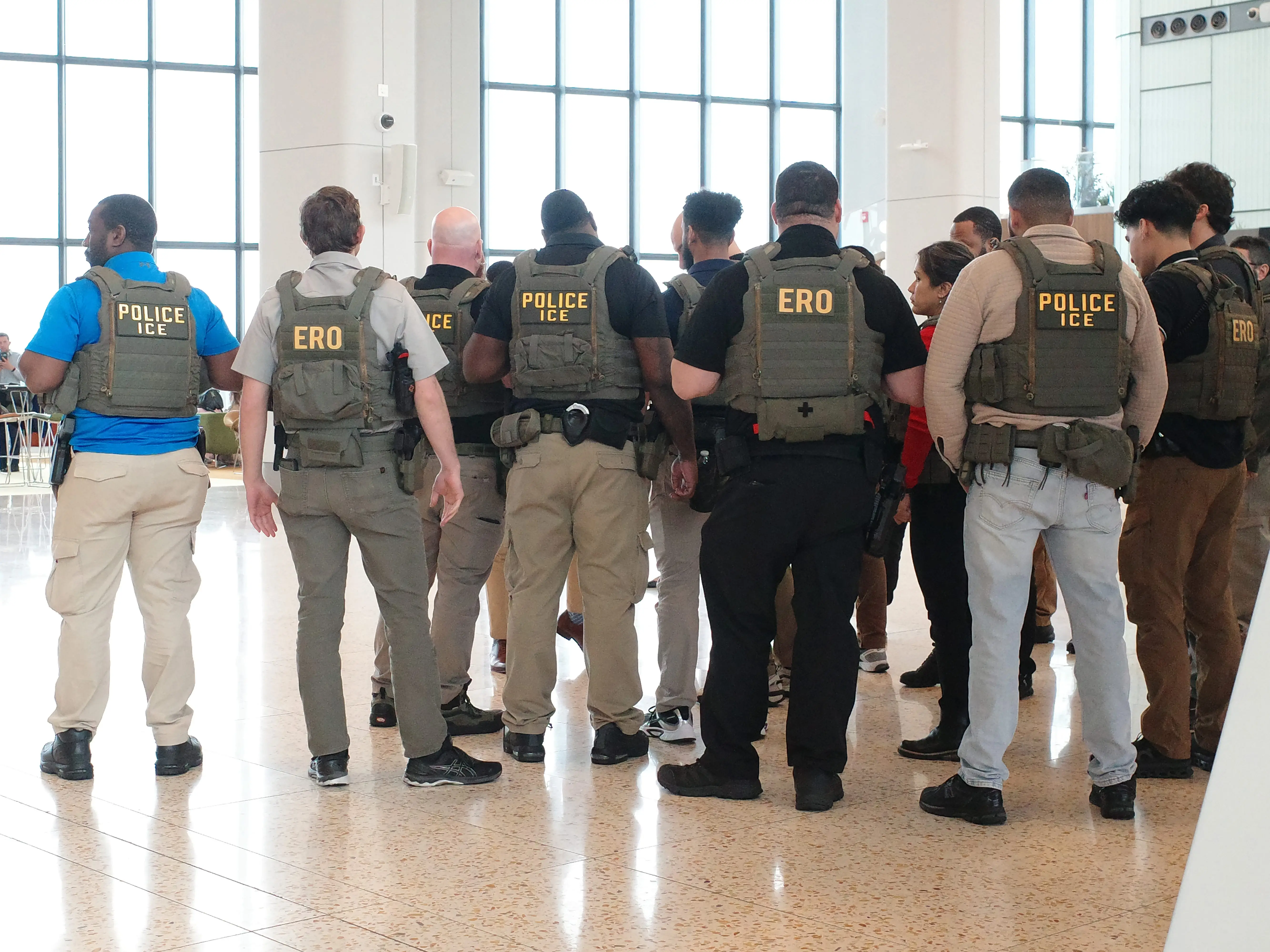 Immigration and Customs Enforcement (ICE) agents patrol Terminal B at LaGuardia Airport on March 23, 2026 in New York City.
