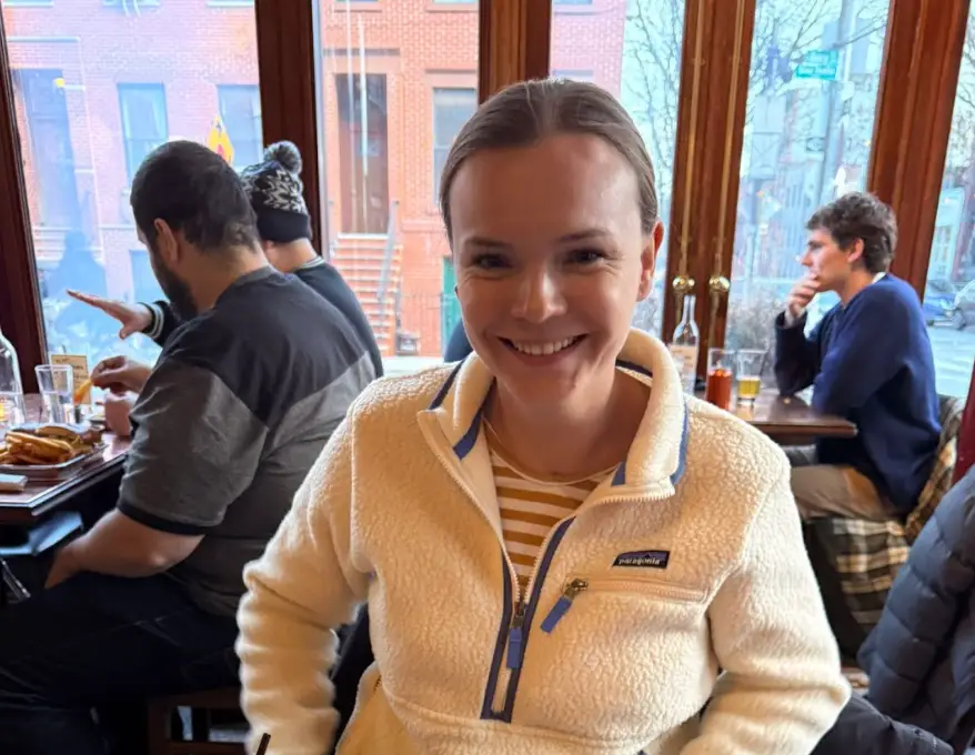 The writer sitting in a restaurant in New York.