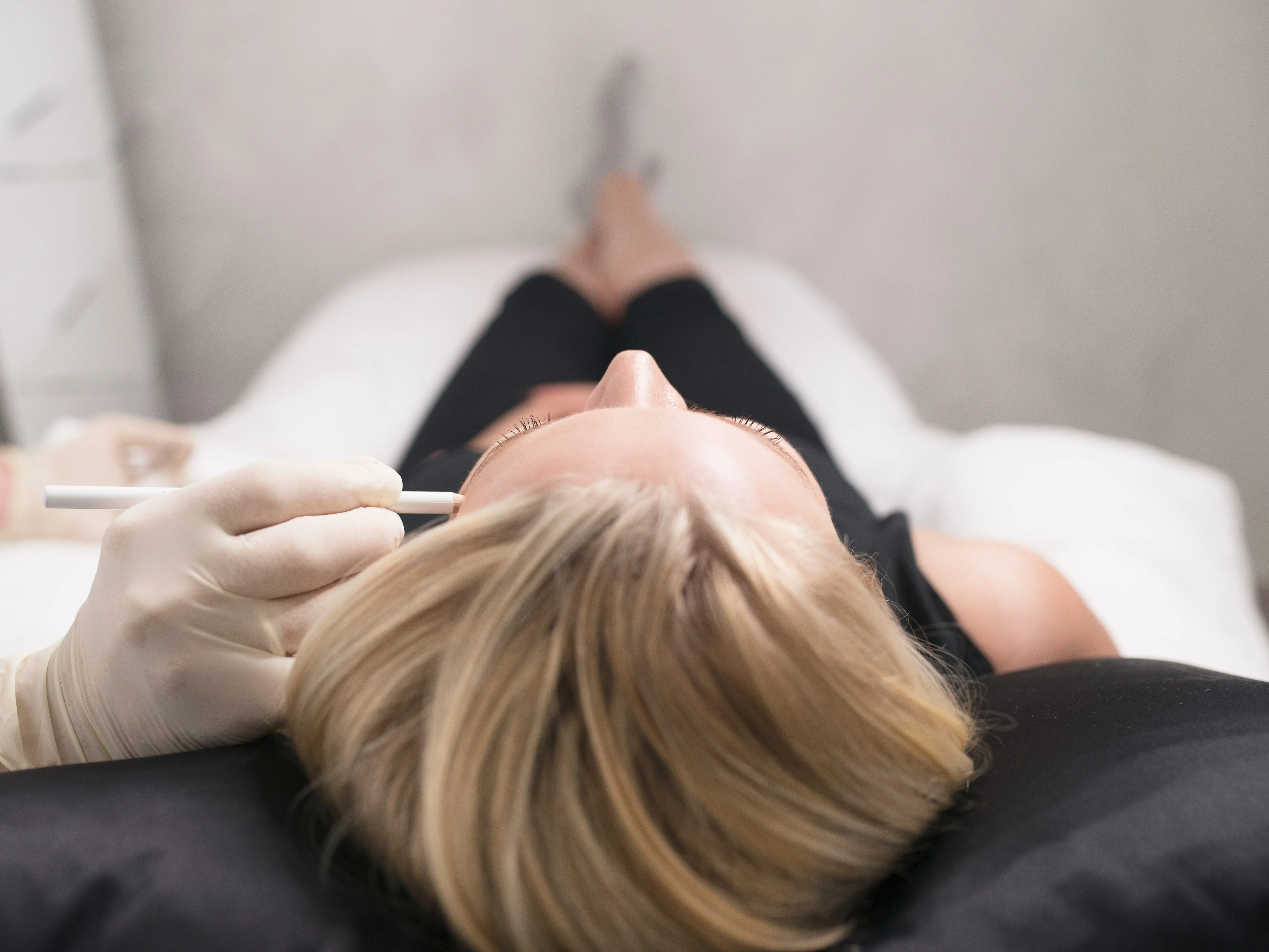 Woman getting drawn on