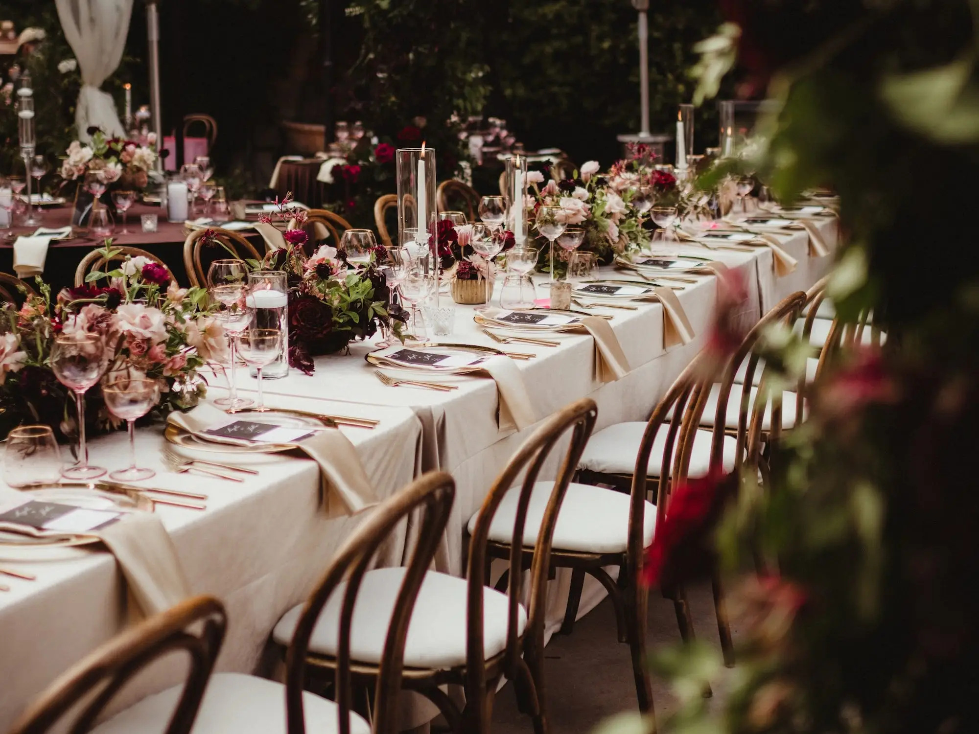 A wedding reception with chartreuse and burgundy decor.