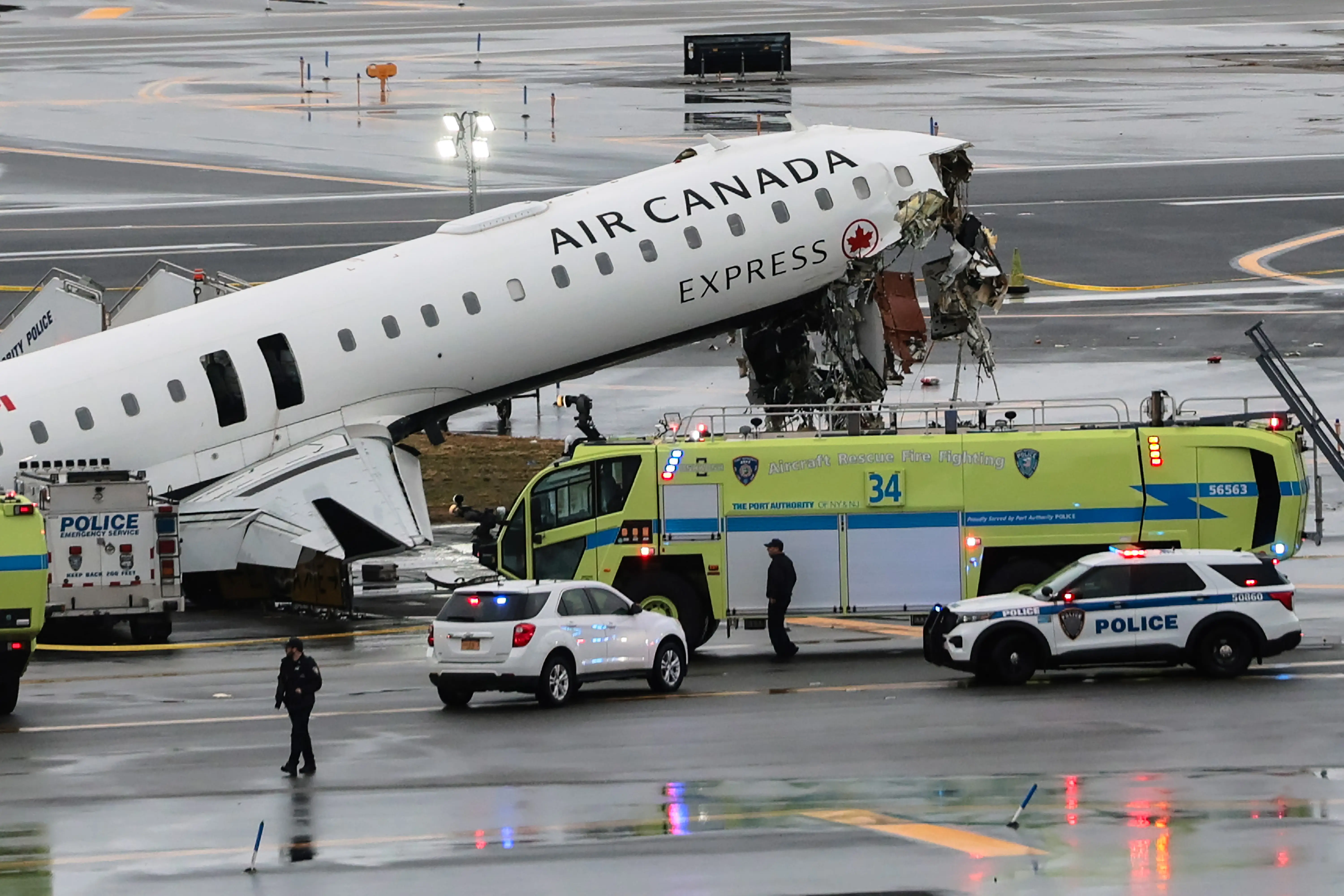 An Air Canada Express CRJ-900 sits on the runway after colliding with a Port Authority fire truck at LaGuardia Airport on March 23, 2026 in New York City.