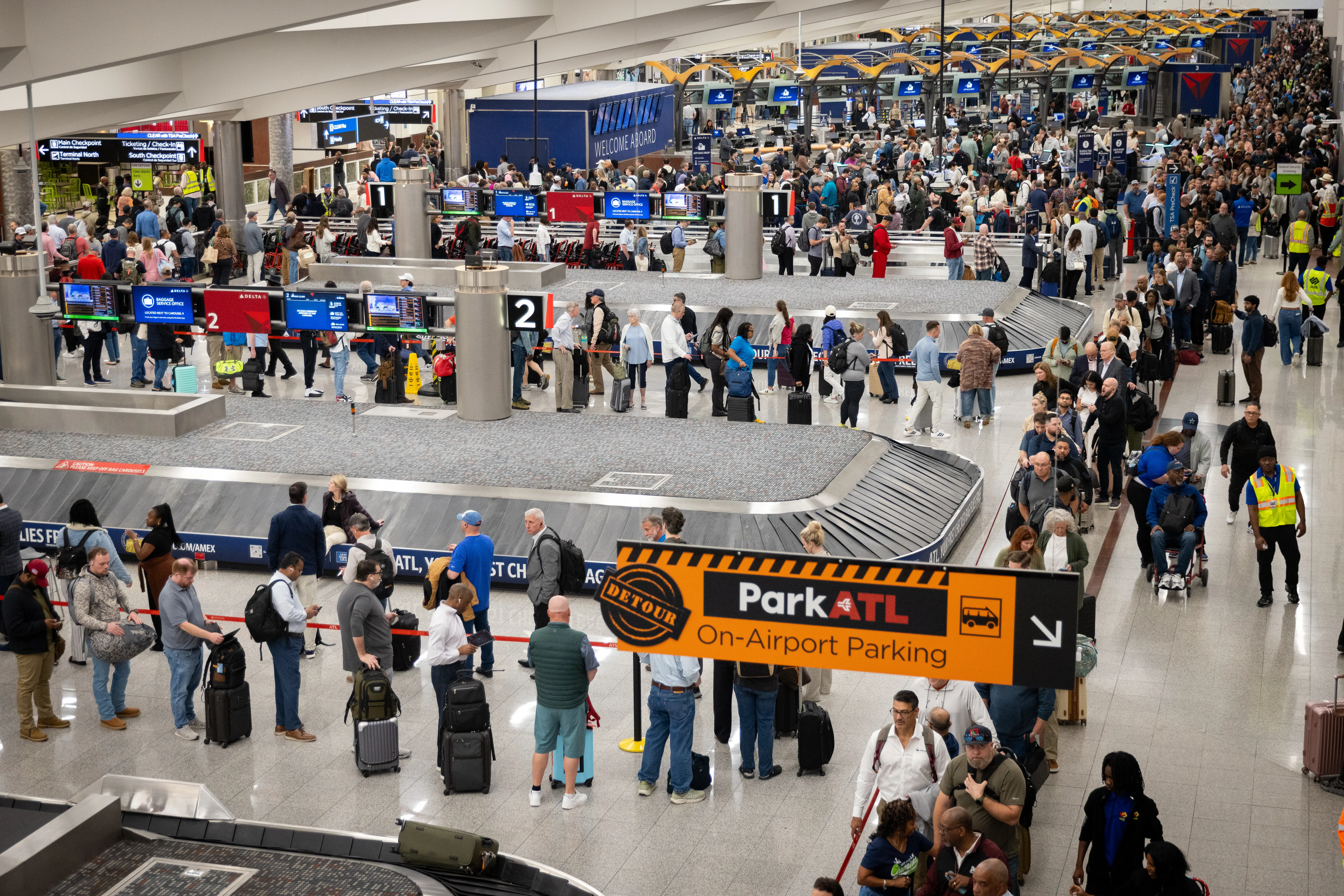 Travelers are seen standing in long lines outside of Hartsfield-Jackson Atlanta International Airport in Atlanta, Georgia, United States on March 23, 2026