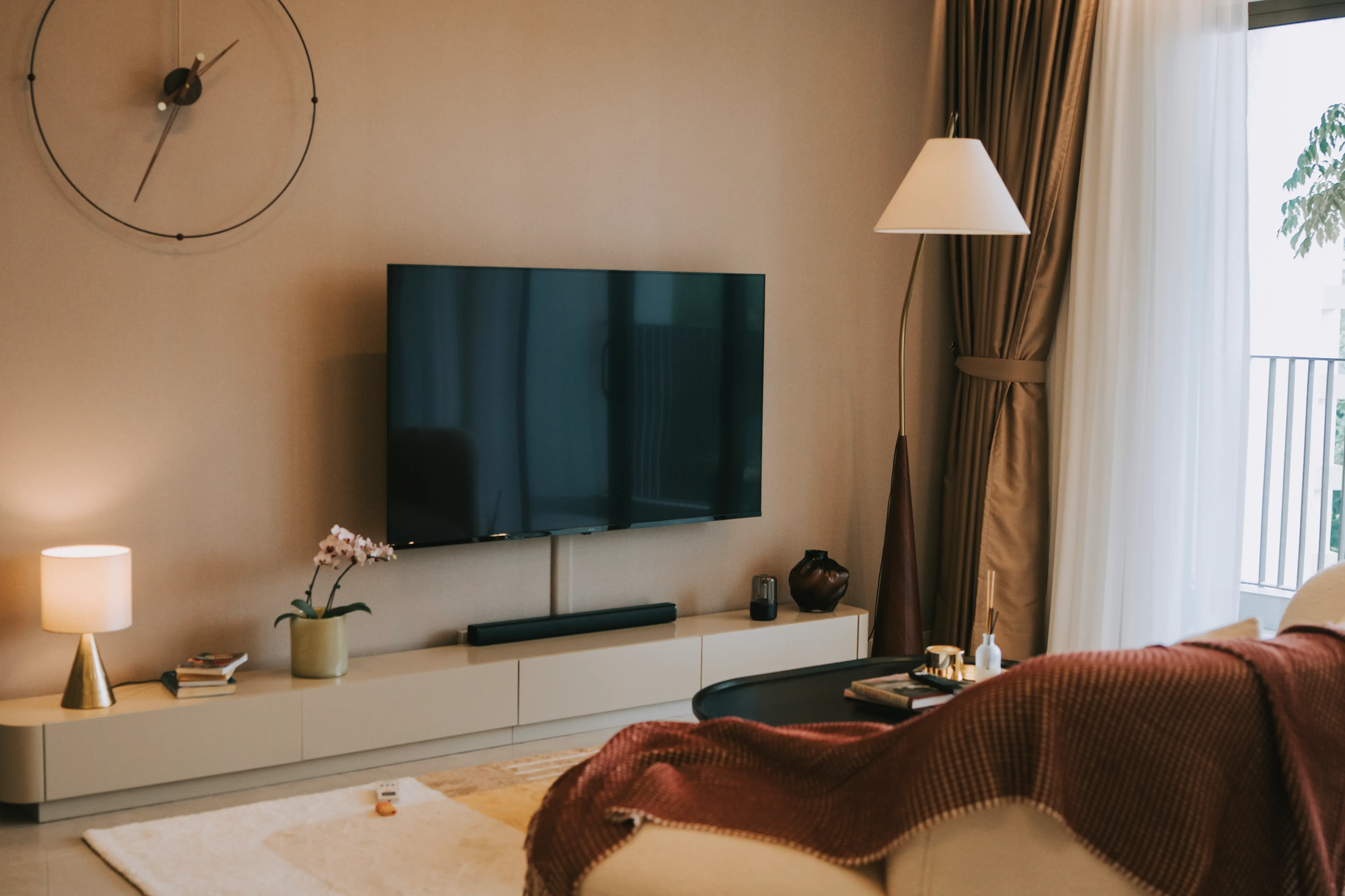 TV mounted on wall with wires covered by cord caps