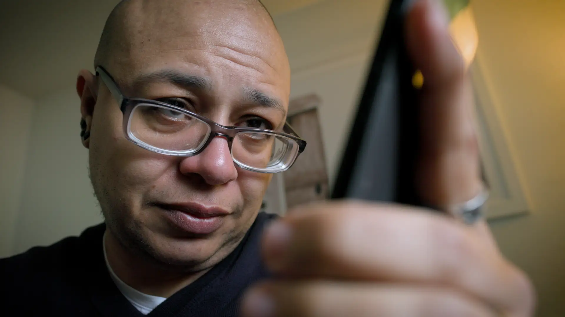 Ian Nicholson looking at his phone.