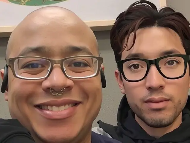 Ian Nicholson next to a virtual image of Min-ho.