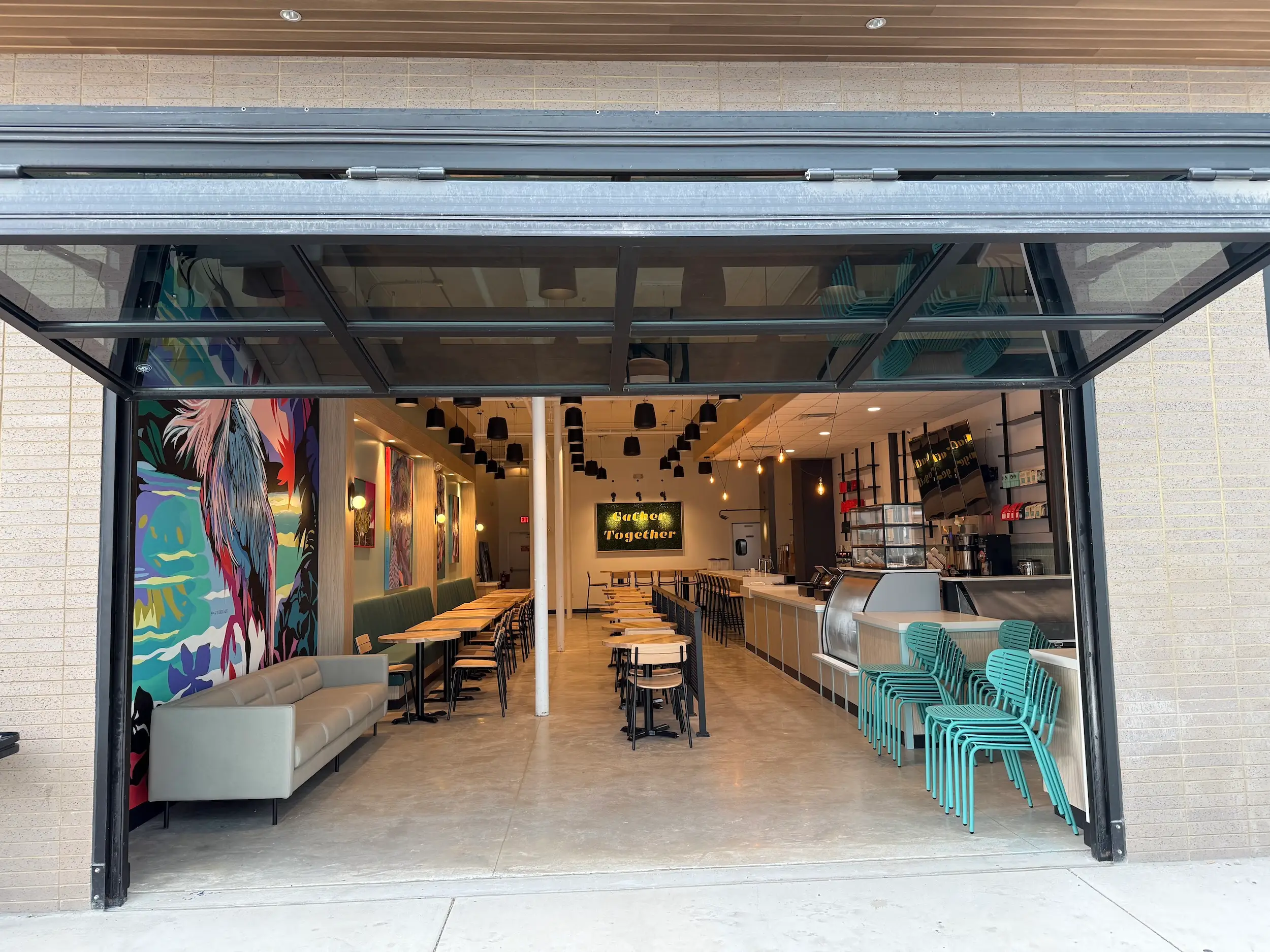 A garage door opening into a coffee shop.