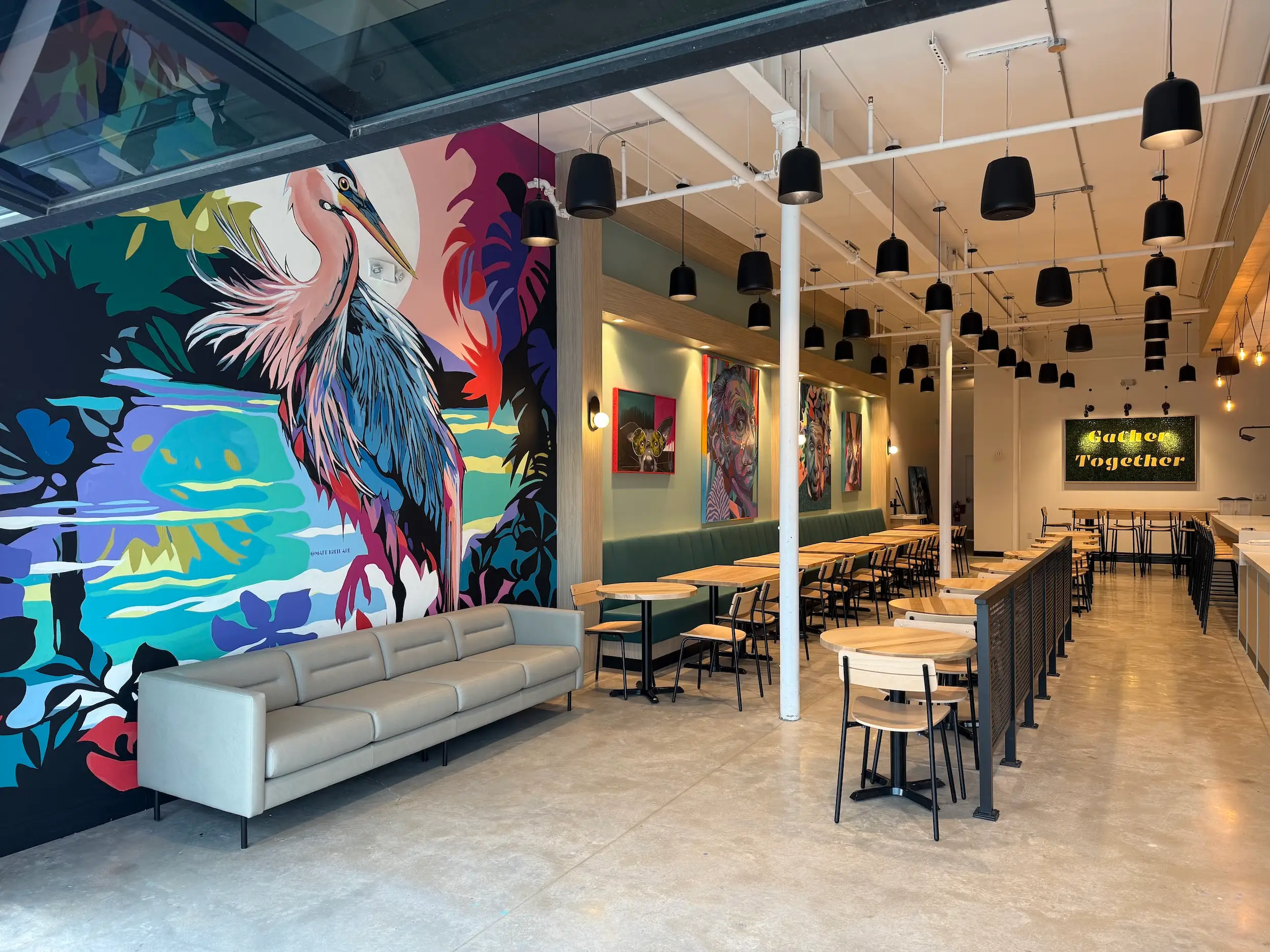 A colorful mural inside a coffee shop.