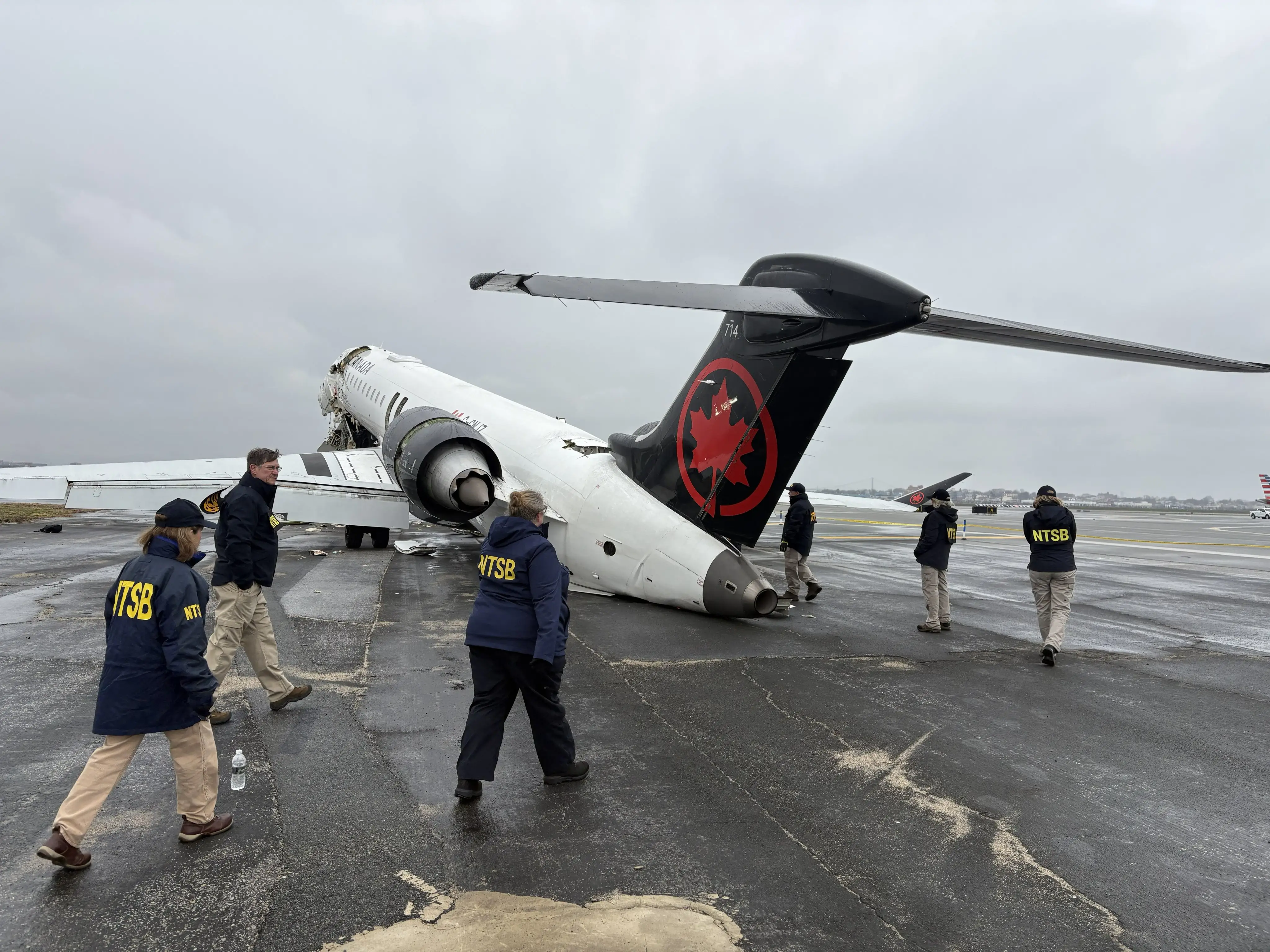 NTSB investigators at the scene of the Air Canada crash.