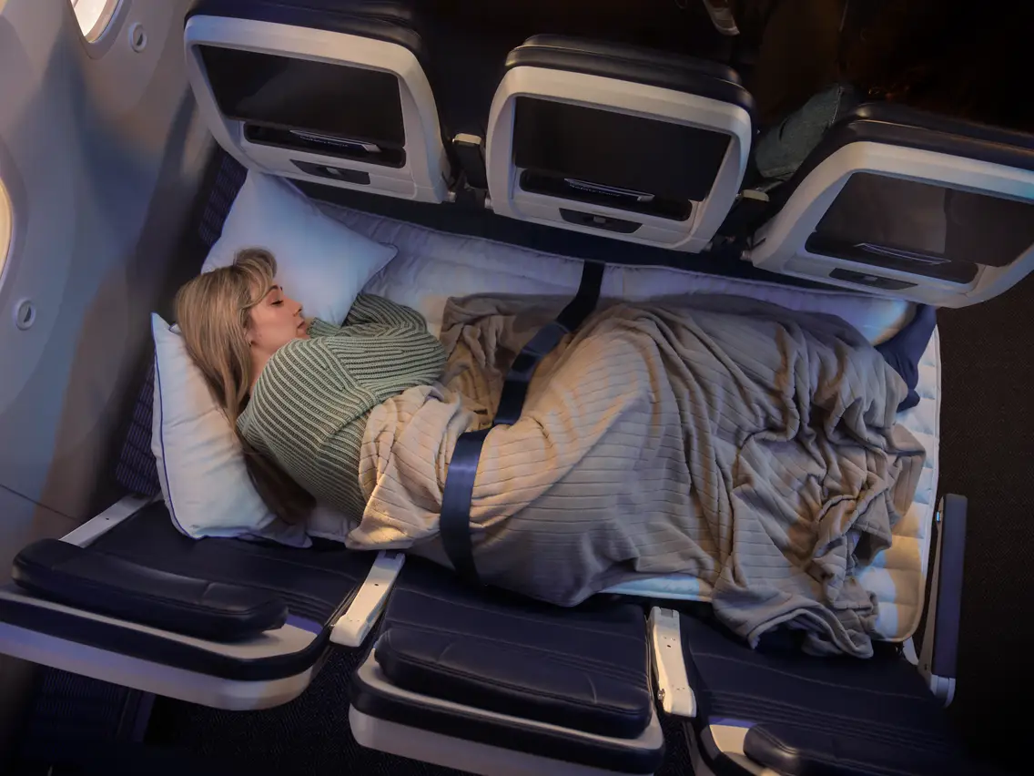 United Airlines' Relax Row with a rendering of a blonde woman sleeping.