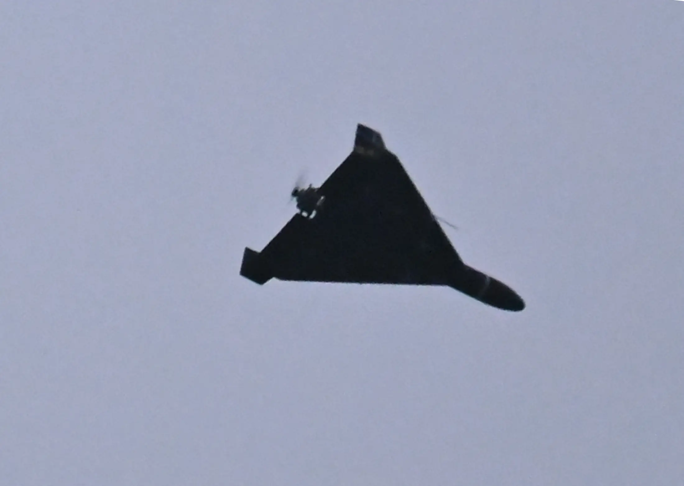 A Shahed-136 soars overhead.