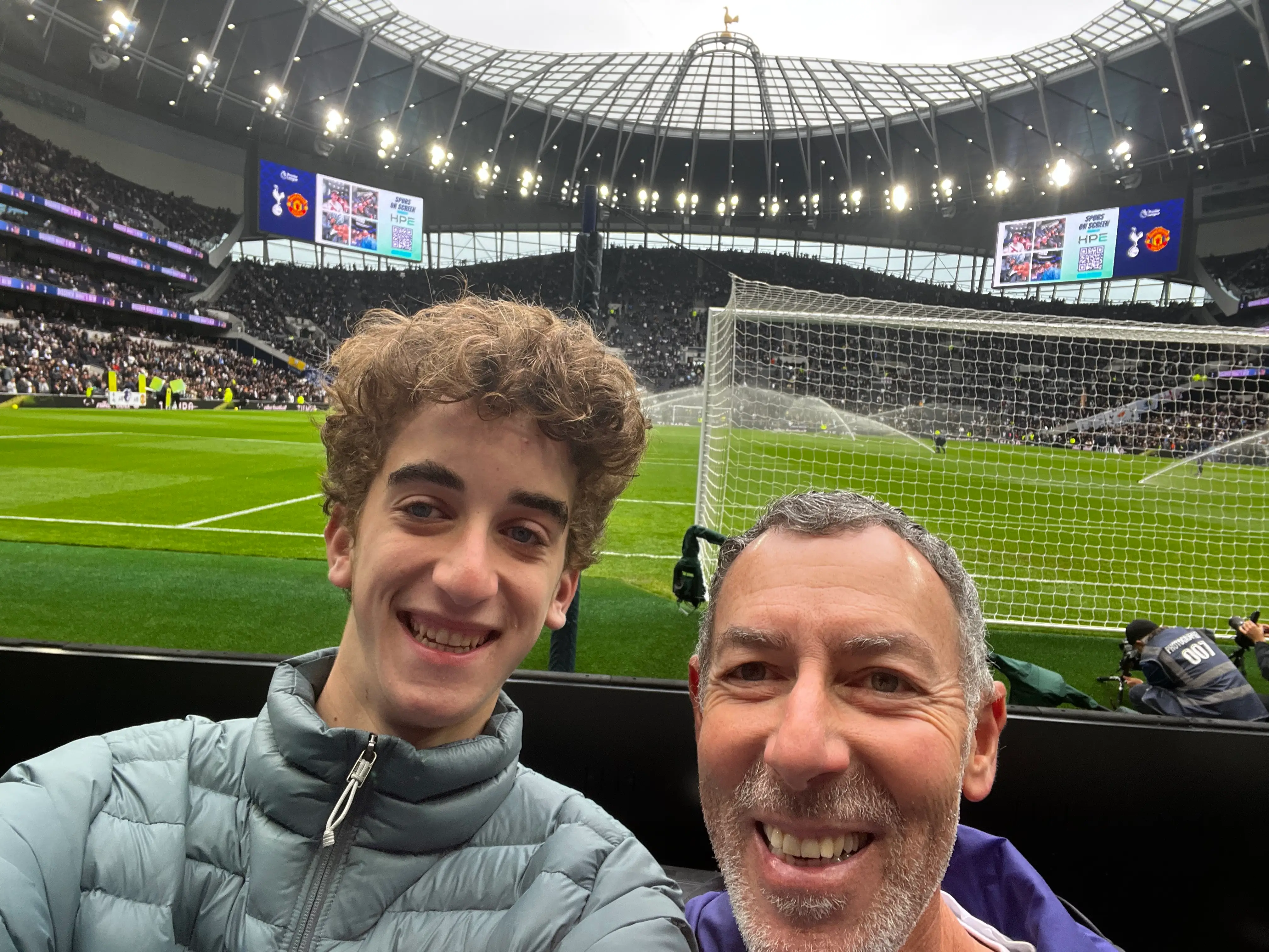 The author's son and husband at a match at Tottenham Stadium.