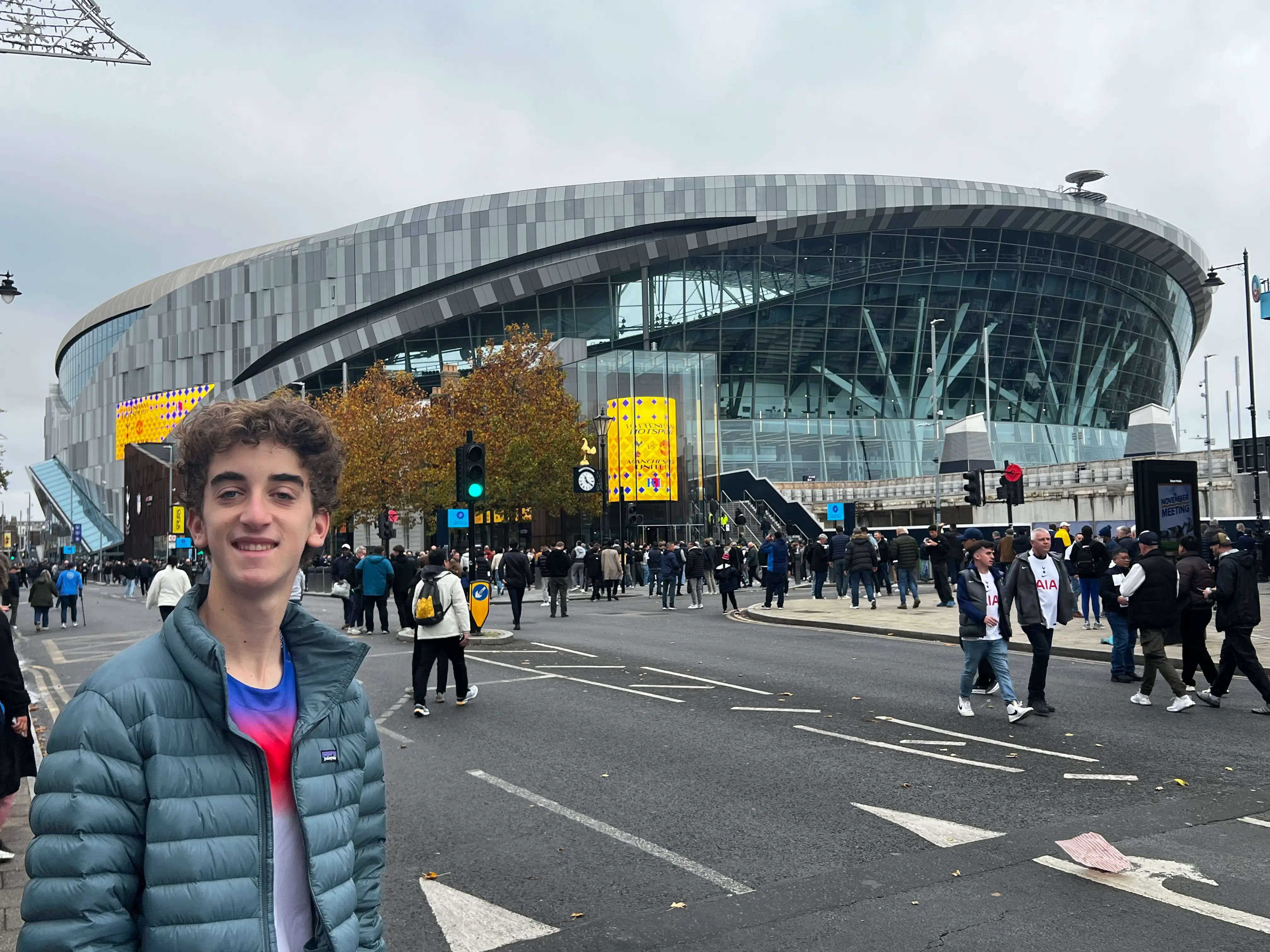 The author's son is shown outside of Tottenham Stadium.