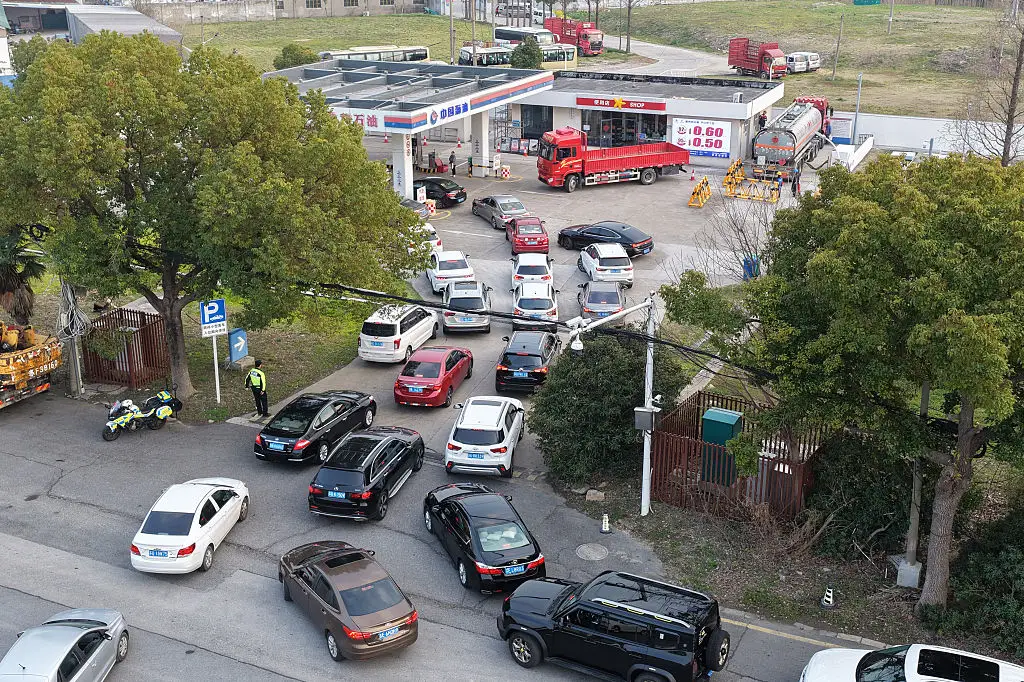 Cars line up for gas in China.