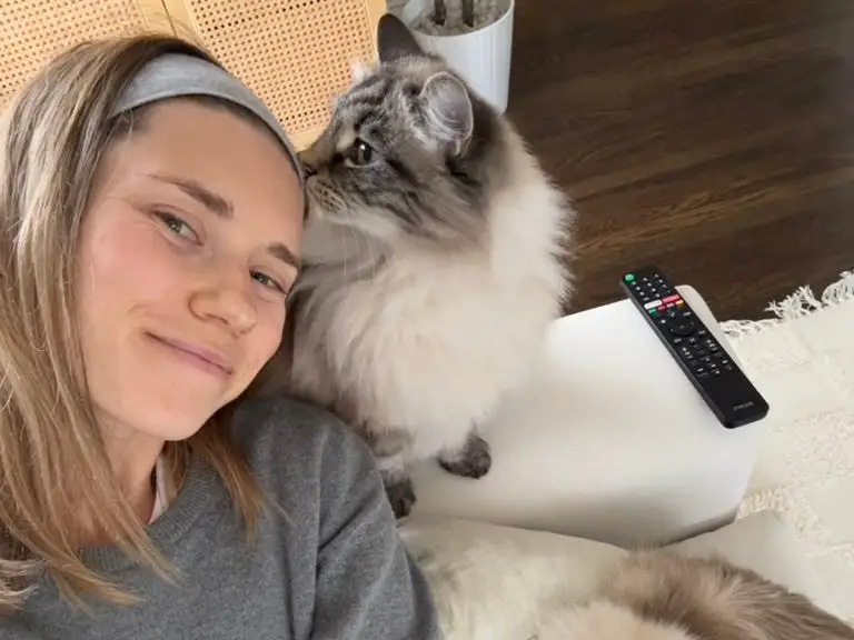 Woman smiling with cat