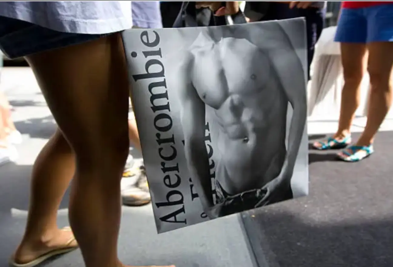 A woman holds a shopping bag outside the Abercrombie & Fitch flagship store in Manhattan in 2010, at the height of what federal prosecutors say was an international sex trafficking ring, run by then CEO Michael Jeffries.