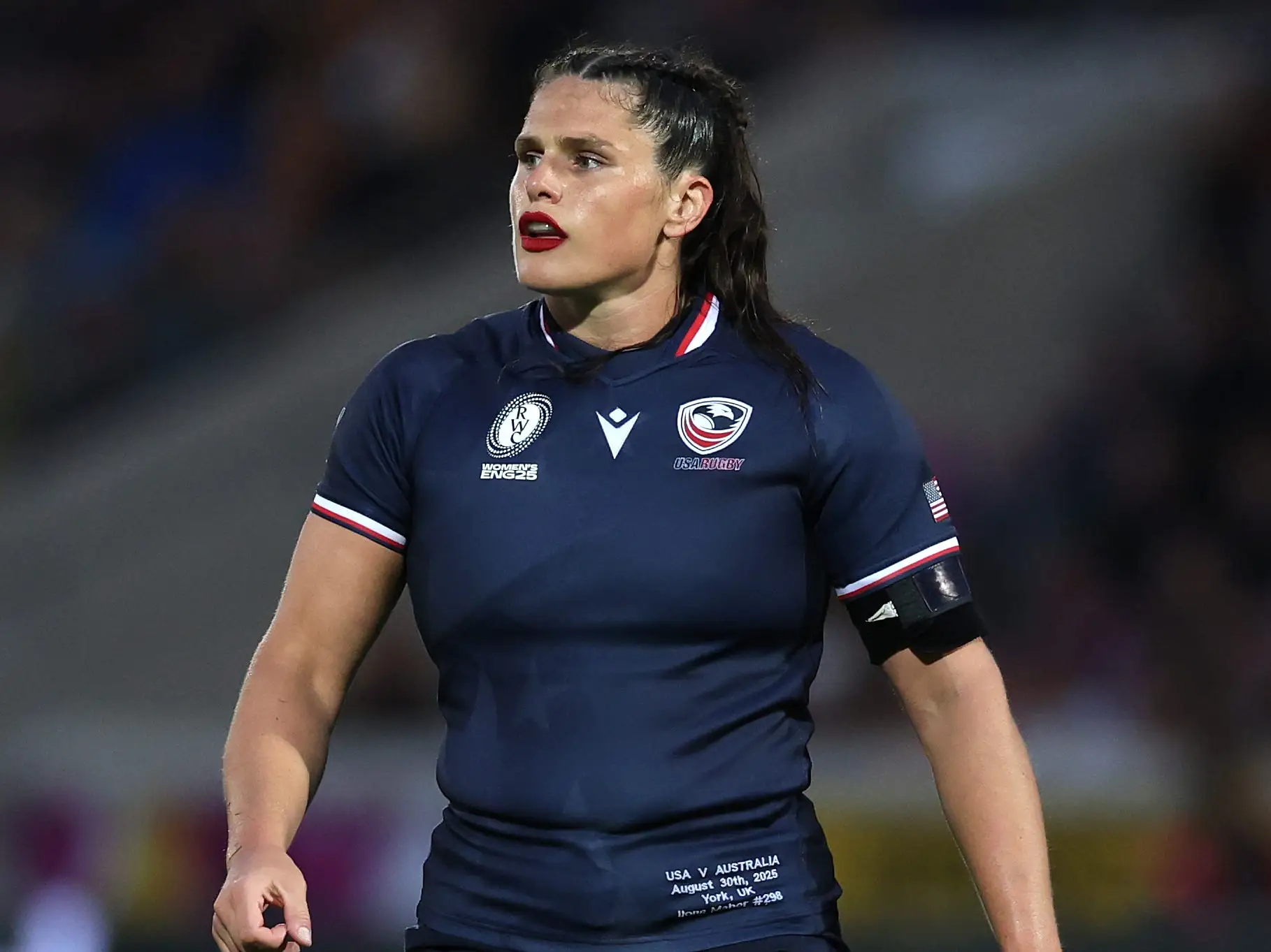 Ilona Maher, rugby player for Team USA, on the field in a blue jersey.