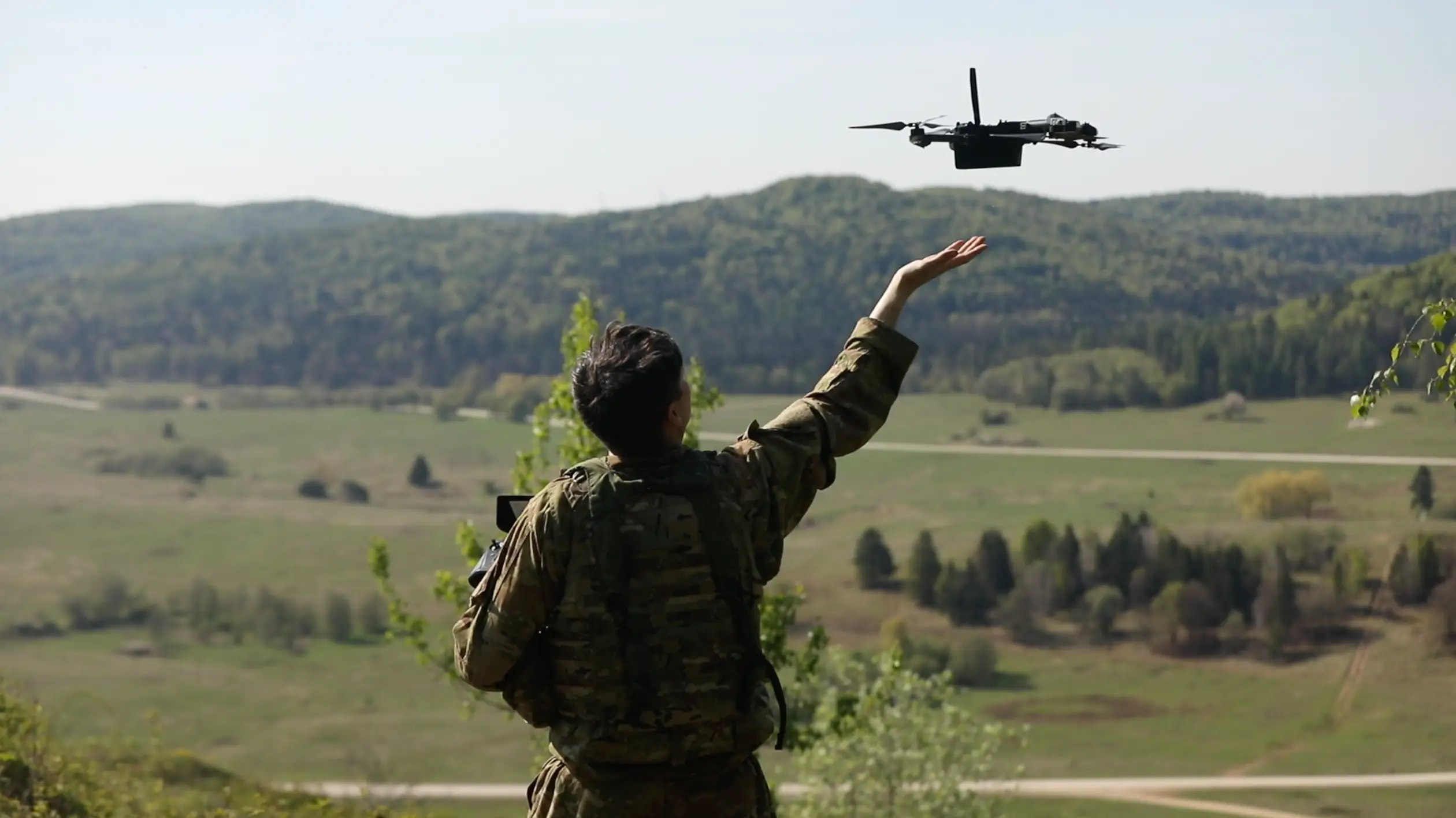 Army soldier deploying a drone.