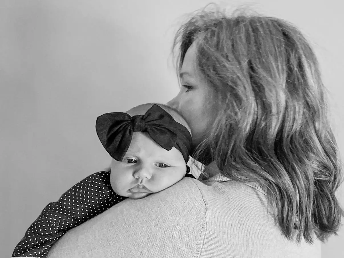The author, Nicole Schildt, poses with her daughter.