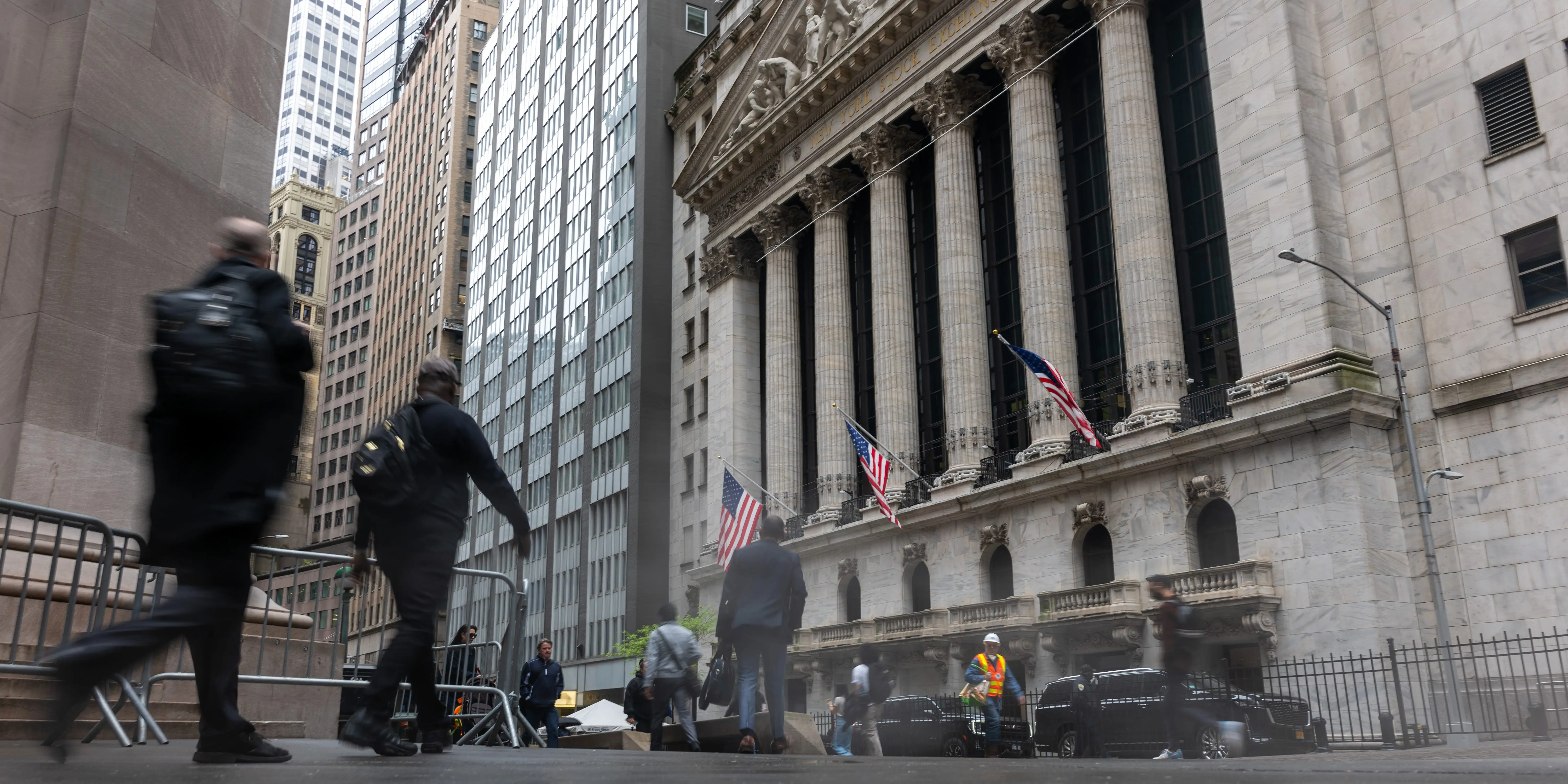 People walking in front of the New York Stock Exchange
