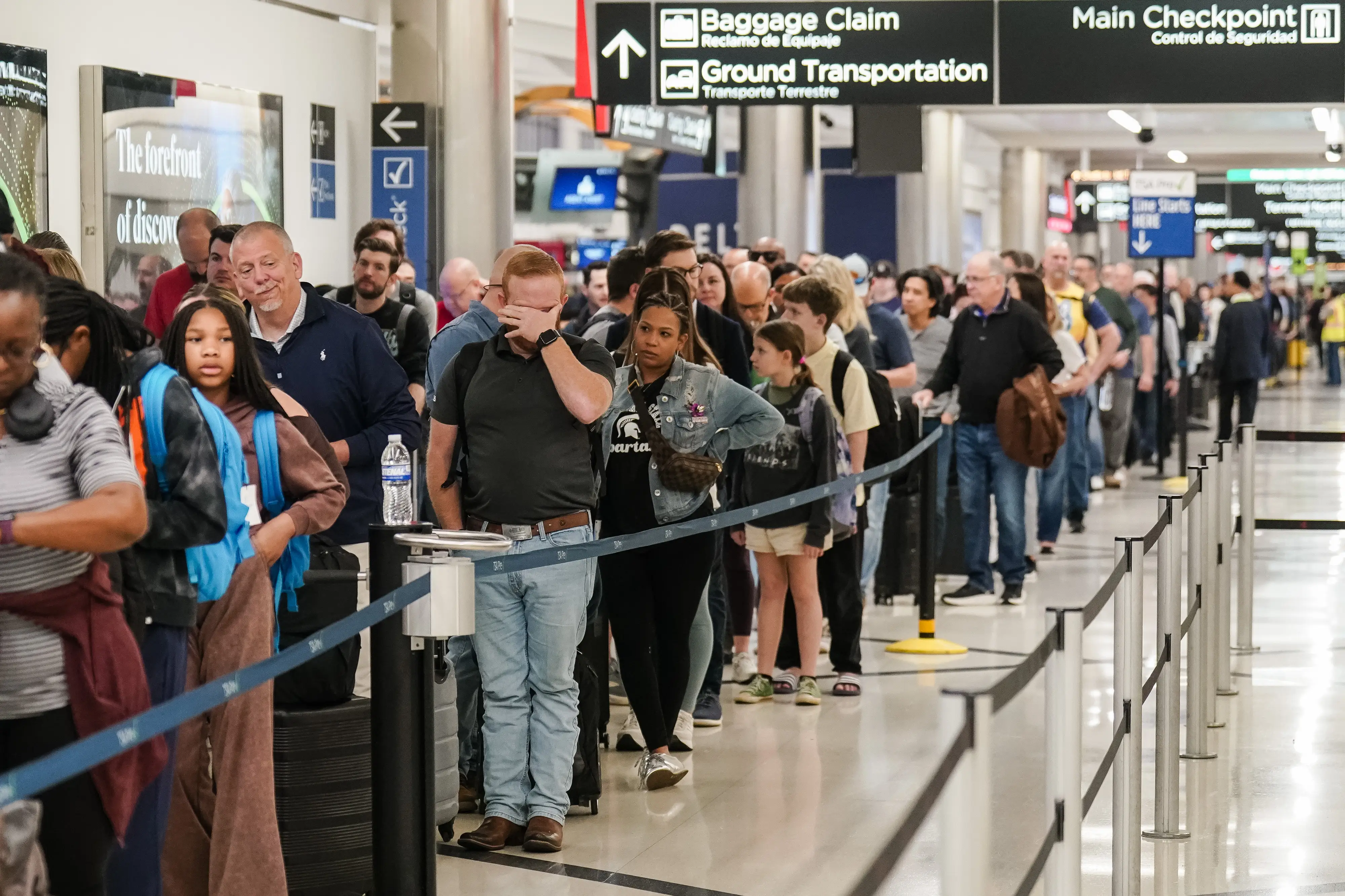 People waiting in TSA Line at Hartsfield-Jackson Atlanta International Airport.
