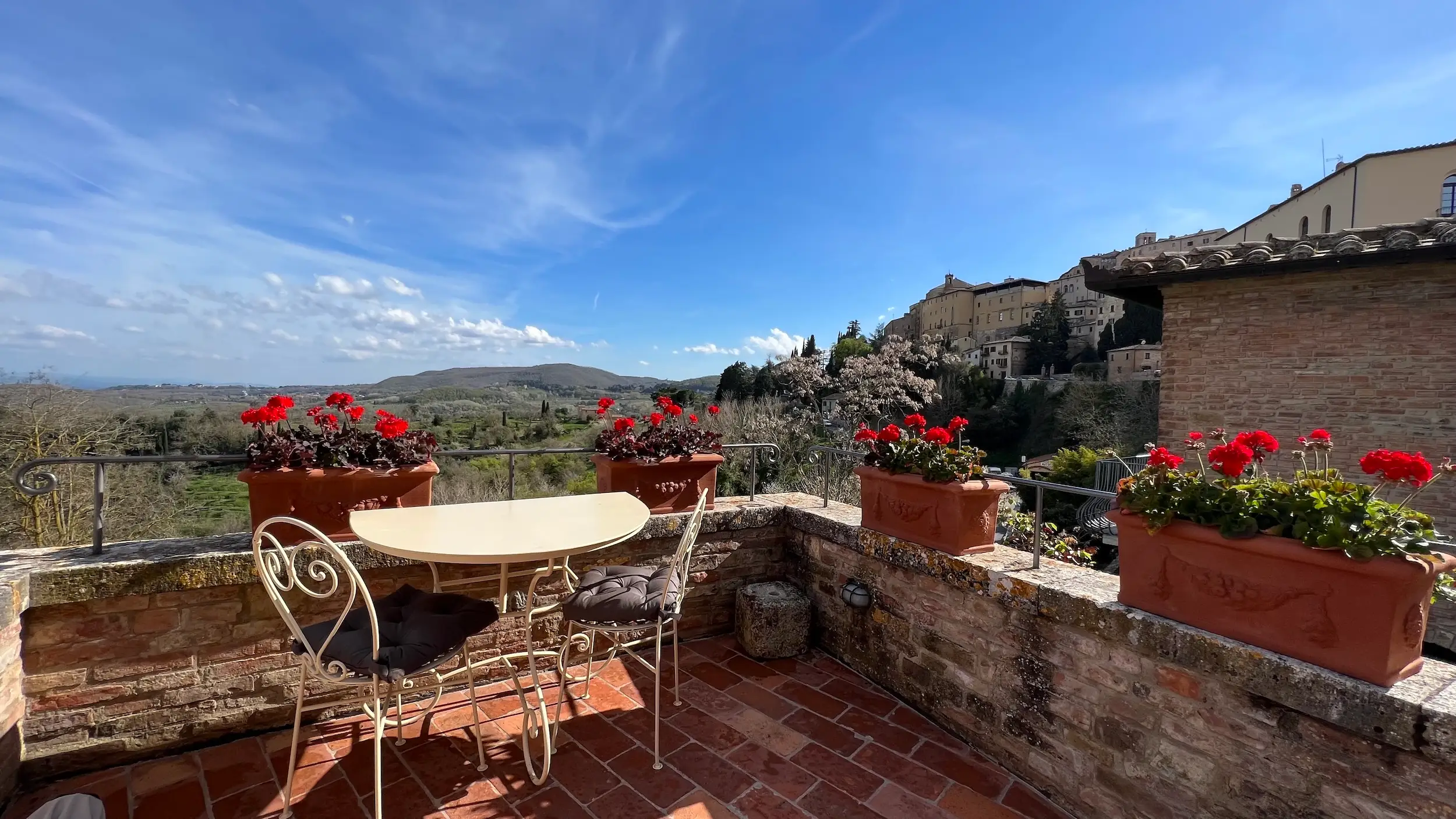 A terrace overlooking the landscape in Italy.