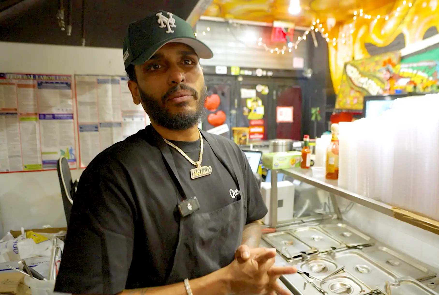 Joshua Dat in his deli