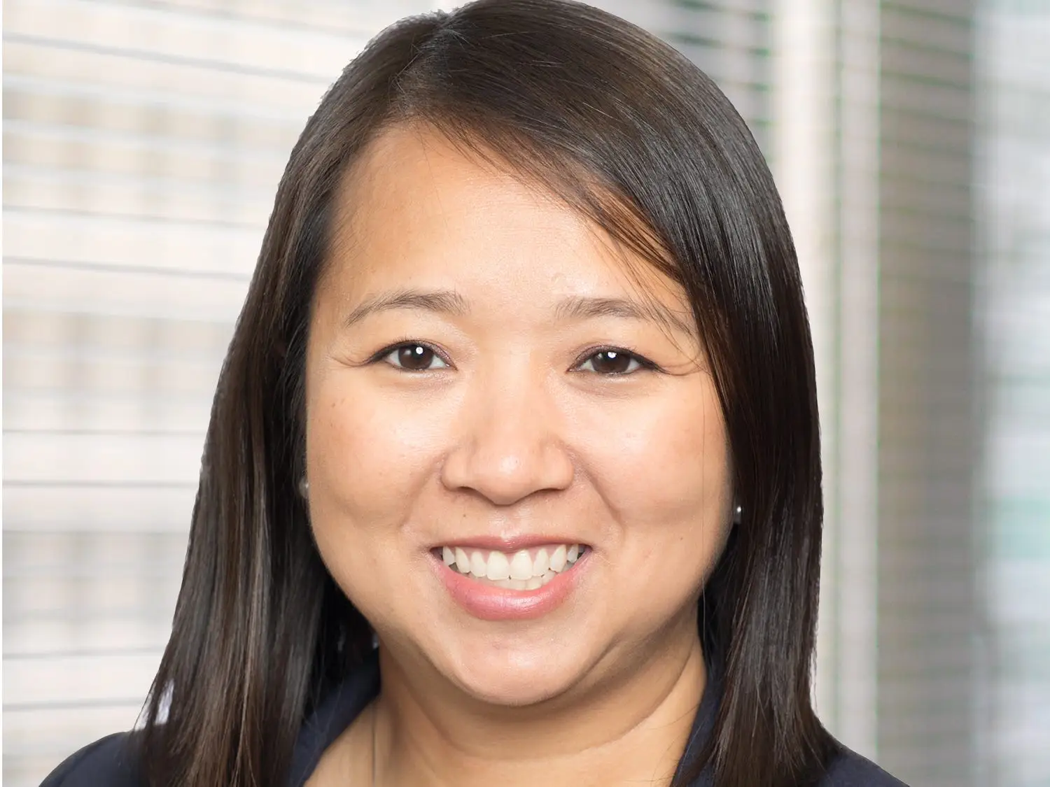 Headshot of Quynh Tran of SMBC