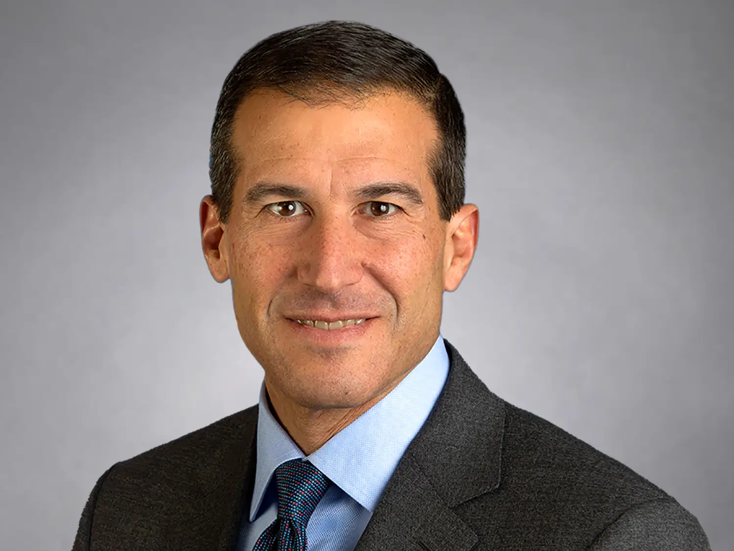 headshot of Dean Criares of DigitalBridge