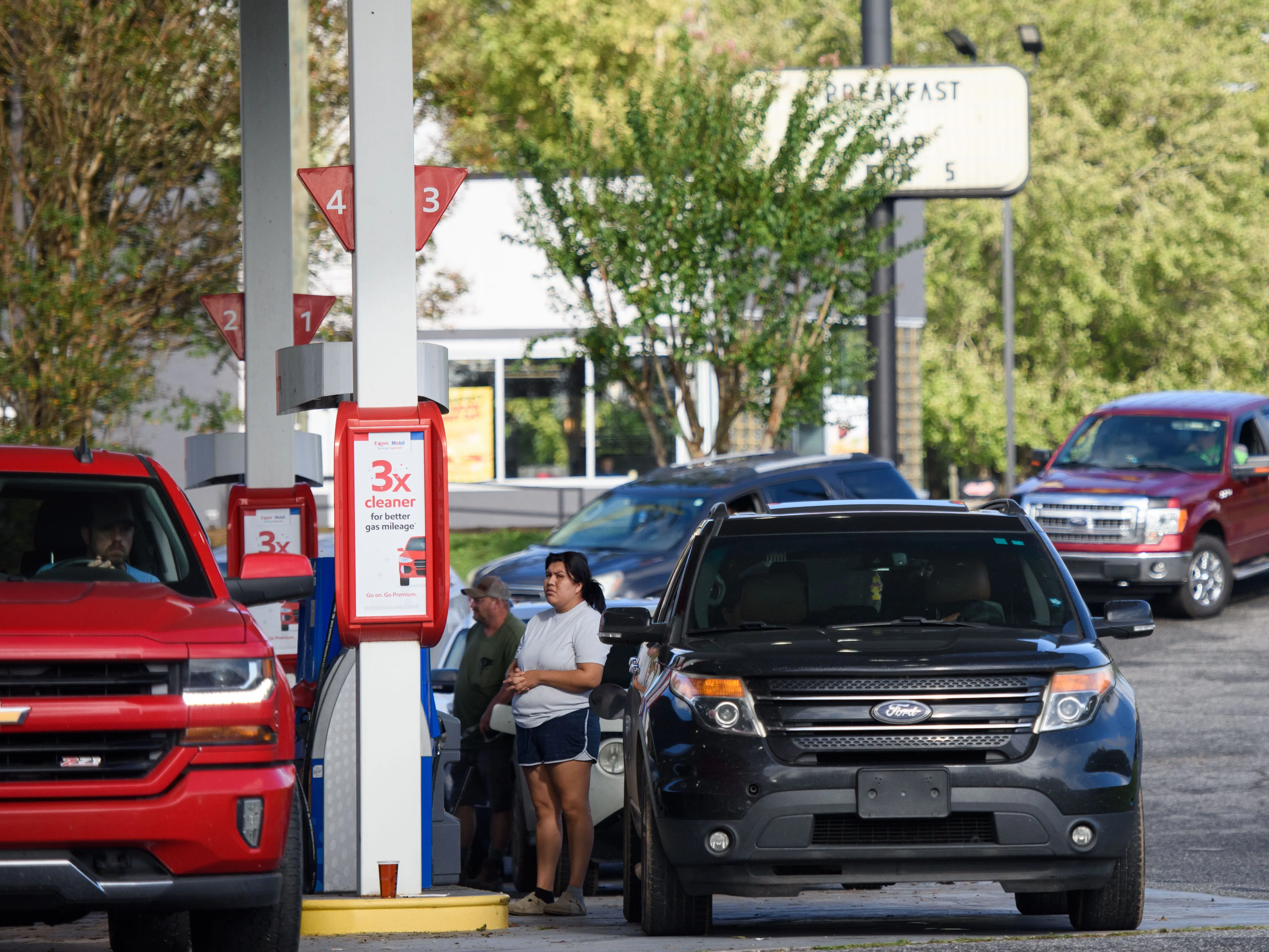 People line up to fill their gas tanks at an Exxon station off Highway 40 on September 29, 2024 in Marion, North Carolina.