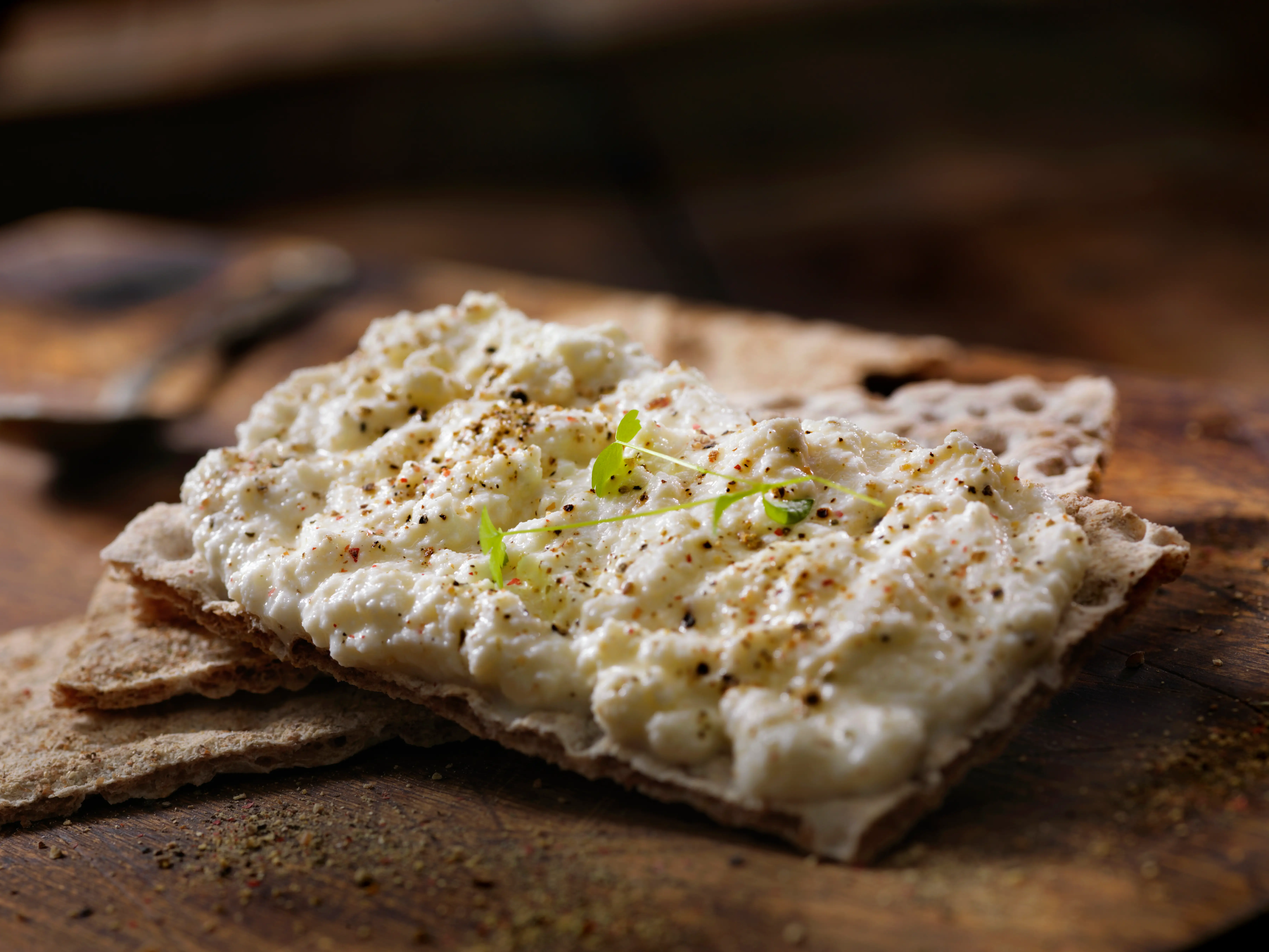 Ricotta cheese on a wholegrain cracker.