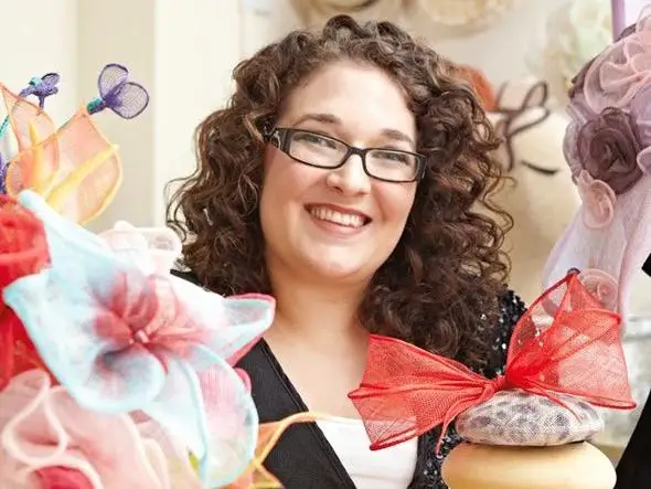 A hatmaker with colorful hats and fascinators