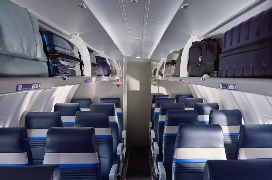 United economy section on CRJ450 with large overhead bins with roller boards.