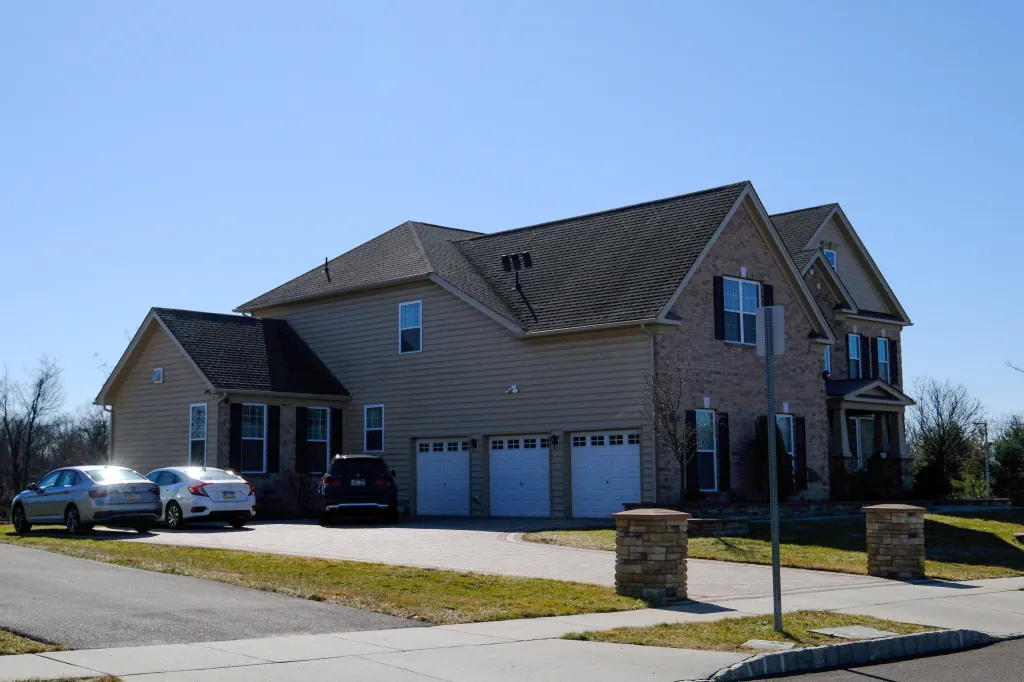 A real estate photograph shows the home of alleged bomber Ibrahim Kayumi.