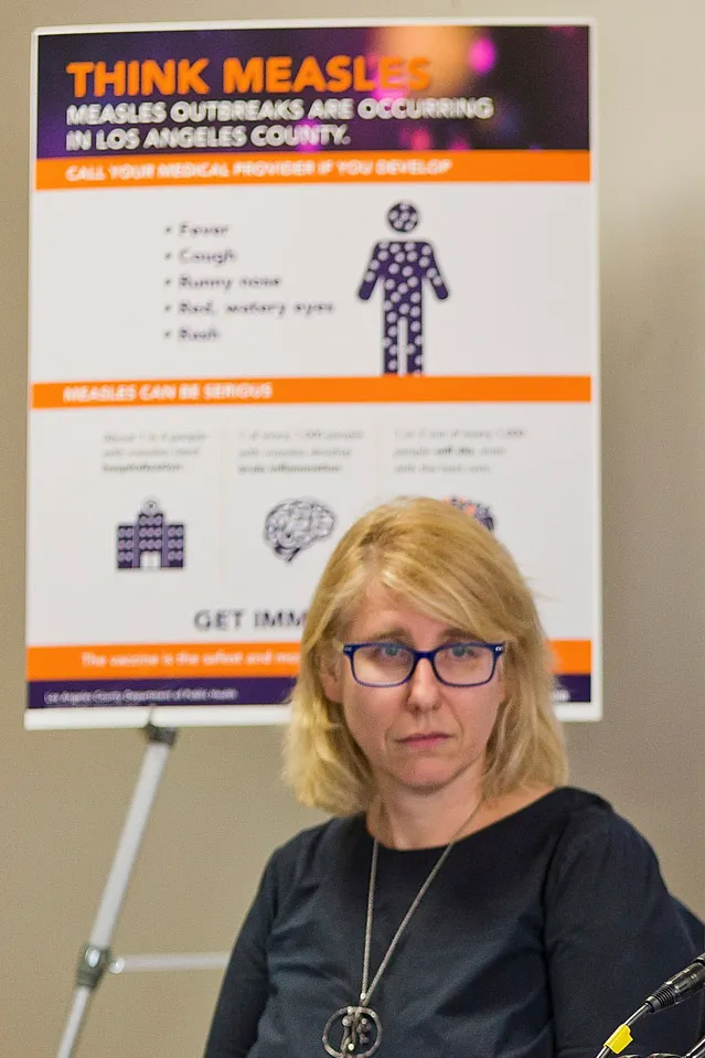 Dr. Sharon Balter in front of a 