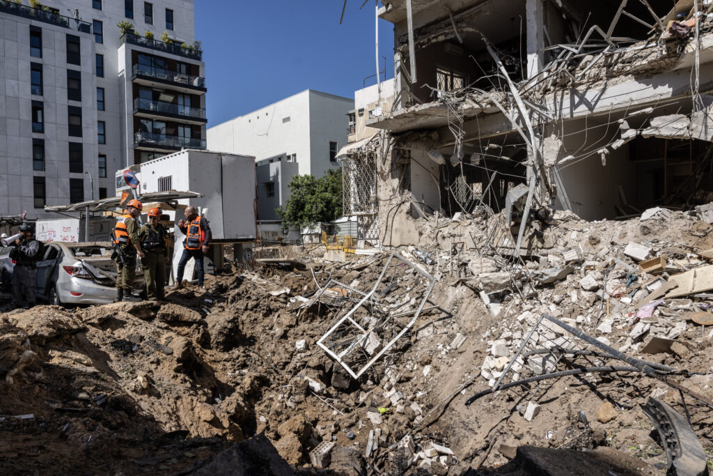 Israel, Iran trade strikes as U.S. says it is pausing attacks on energy targets