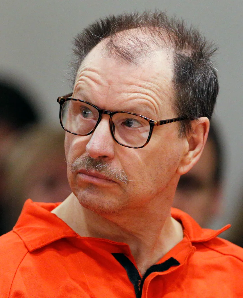 Photo of a man in an orange jumpsuit with glasses and a mustache, identified as a Green River Killer victim.