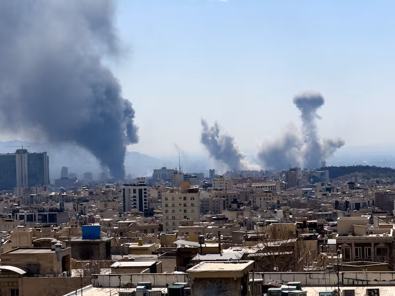 Plumes of smoke rise following reported explosions in Tehran on March 1, 2026, after Iran's supreme leader, Ayatollah Ali Khamenei, was killed a day earlier in a large U.S. and Israeli attack, prompting a new wave of retaliatory missile strikes from Iran. (Photo by Mahsa / Middle East Images / AFP via Getty Images)