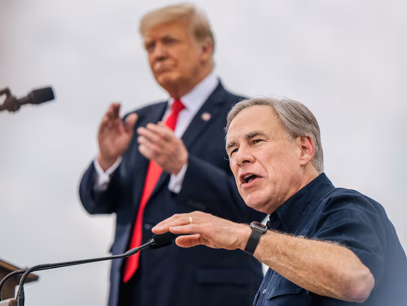 Texas Gov. Greg Abbott speaks alongside former President Donald Trump during a tour to an unfinished section of the border wall on June 30, 2021 in Pharr, Texas.