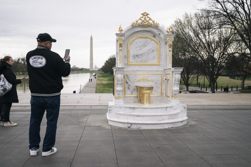 Golden toilet statue on Mall pays faux tribute to Trump renovations