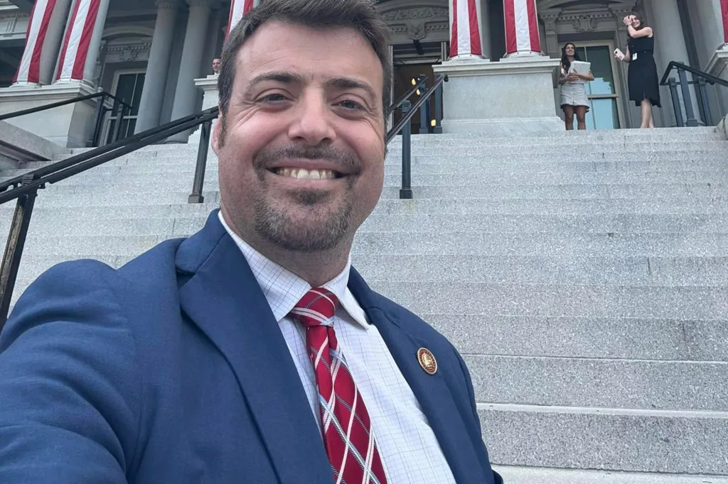 Rep. Ernie Yarbrough of Alabama smiling on the steps of a building.