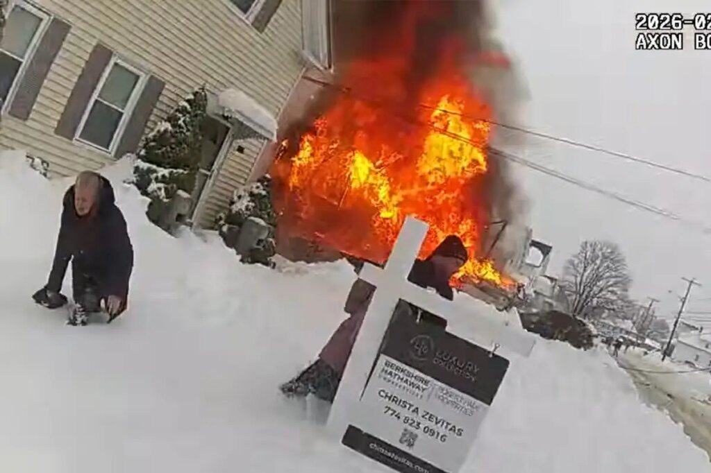 Dramatic footage captures cops desperately hunting for hydrants under snow as blaze critically hurts mom, tot
