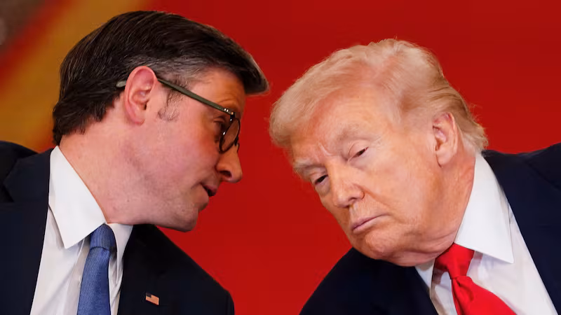 U.S. President Donald Trump listens to U.S. Speaker of the House Mike Johnson (R-LA) during a round table on collegiate sports in the White House in Washington, D.C., March 6, 2026. REUTERS/Nathan Howard