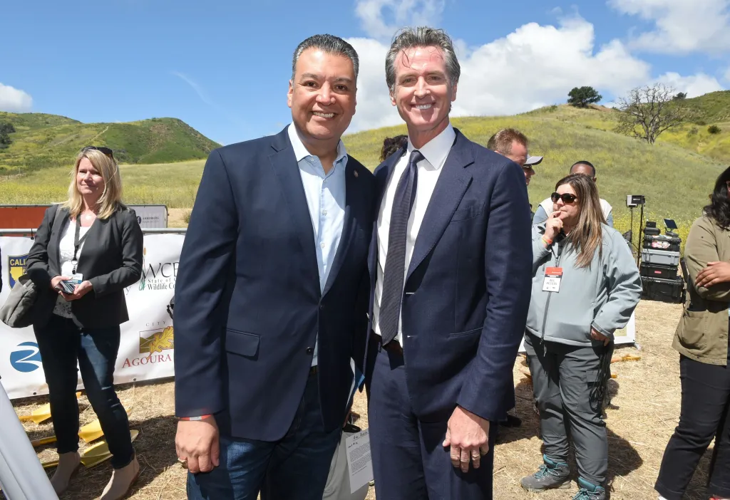 Two men in suits smiling at the Wallis Annenberg Wildlife Crossing Groundbreaking Celebration.